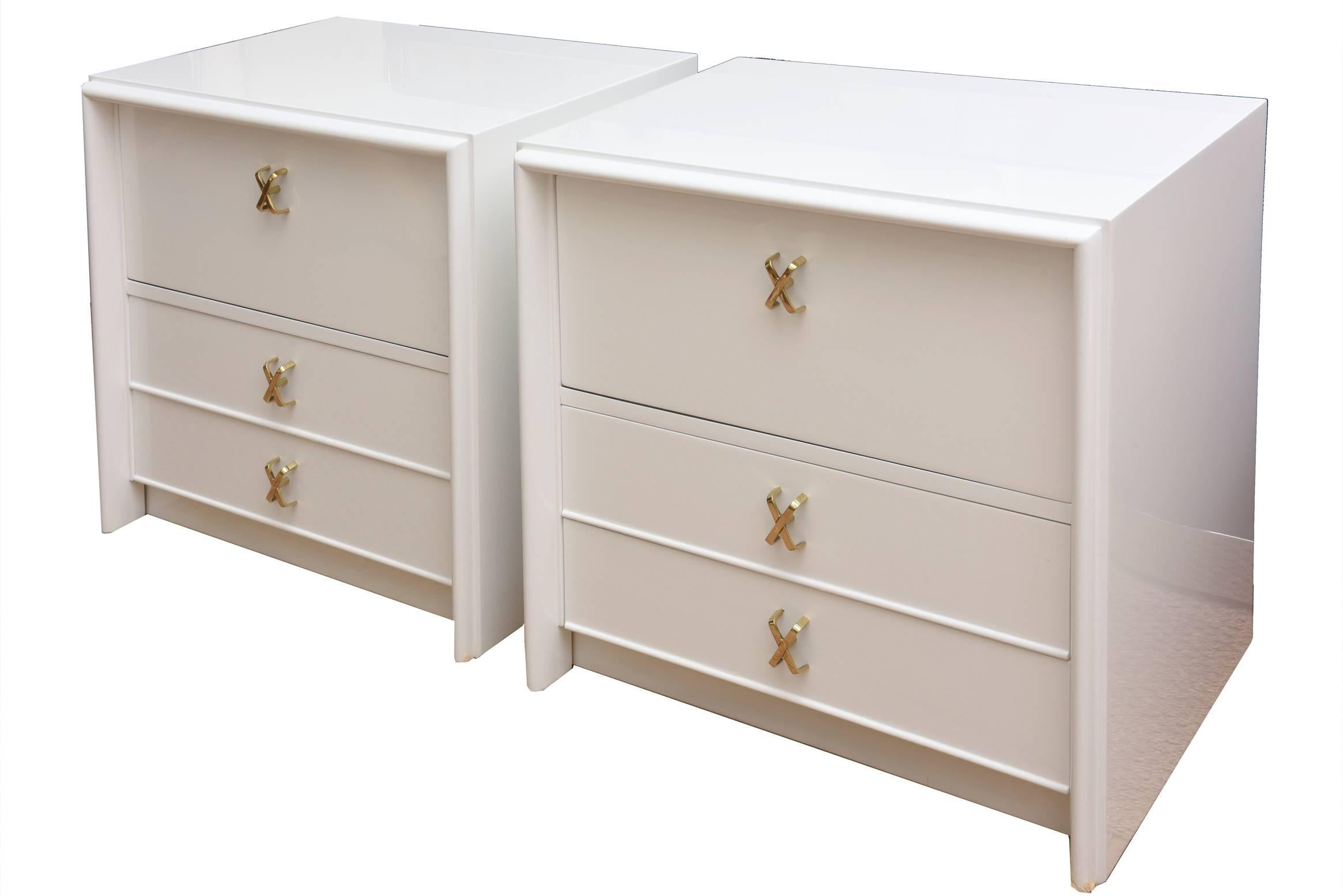 This pair of Paul Frankl newly restored white lacquered and polished brass X-pull nightstands are Classic and modern. They are signed in the drawer Johnson Furniture Co. They are pure Mid-Century.
The iconic X-pulls have all been beautifully