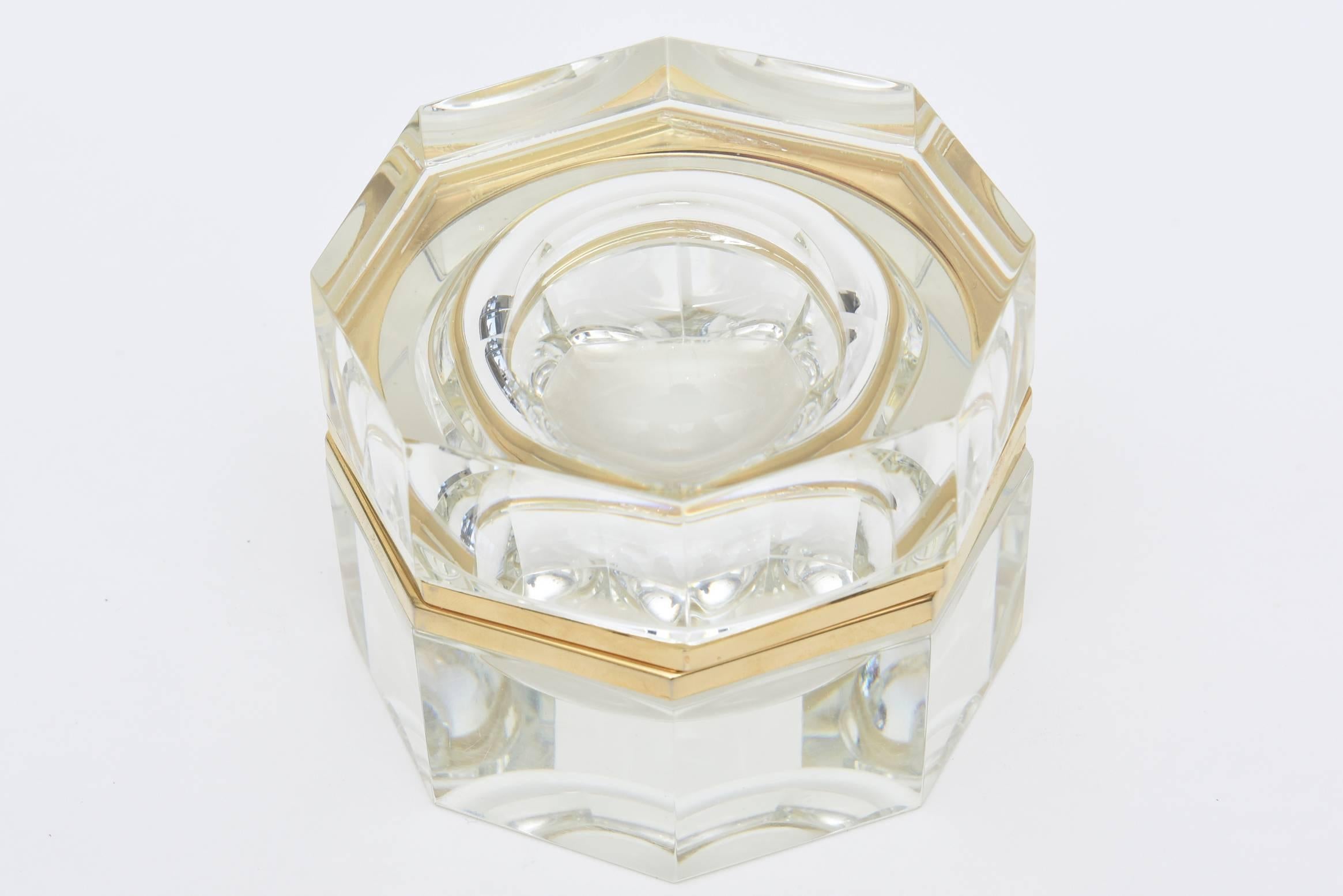 This beautiful and heavy Italian vintage murano clear faceted glass hinged box is trimmed in brass. The unusual shape of the octagon makes for a great presentation. It is great for jewelry, money or many other uses.  One can always use this for