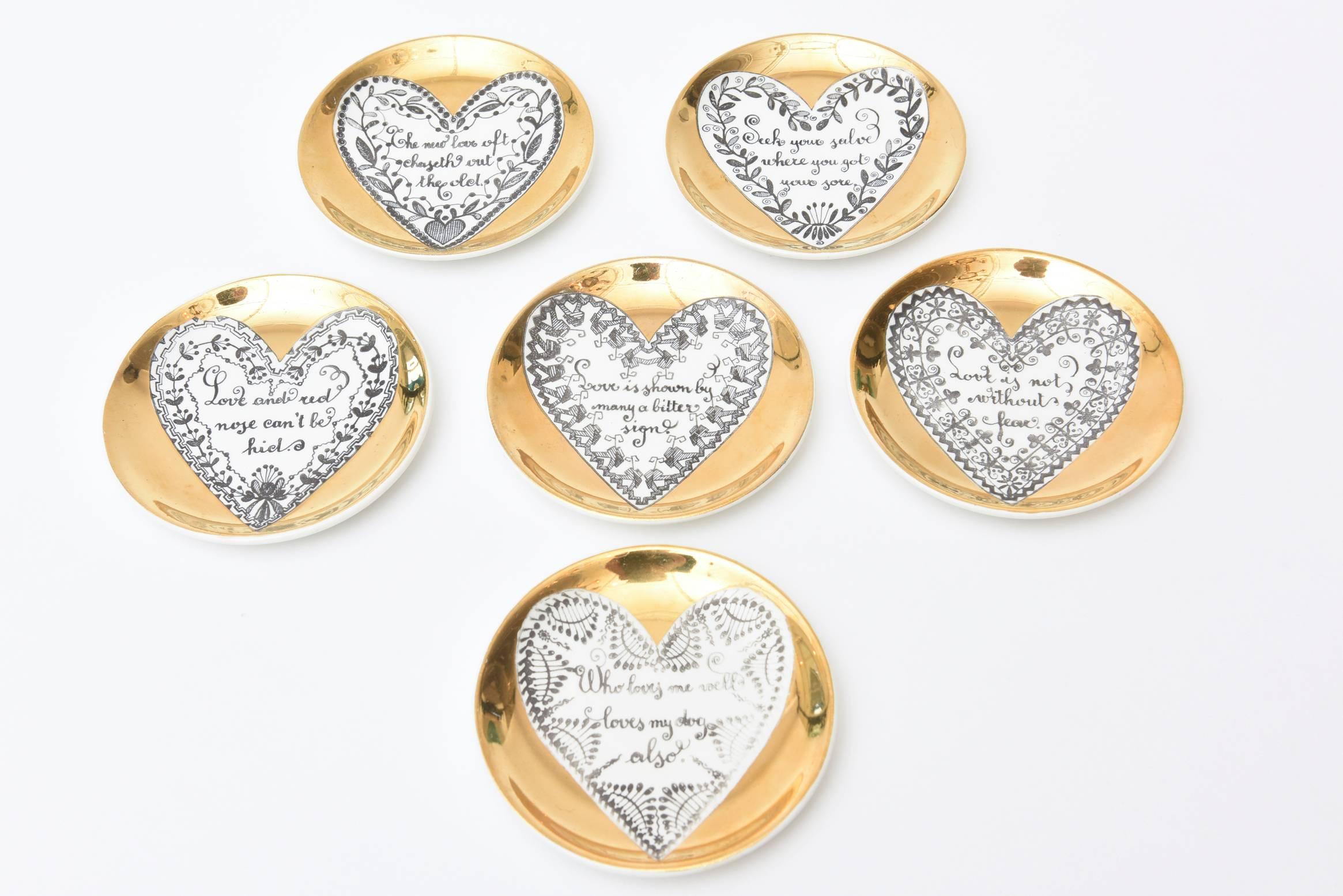 These delightful and romantic verbages are depicted within the heart shape of these hallmarked Piero Fornasetti gilded porcelain love coasters/ small plates/barware.
They are lithographically printed and are the only works that Fornasetti
