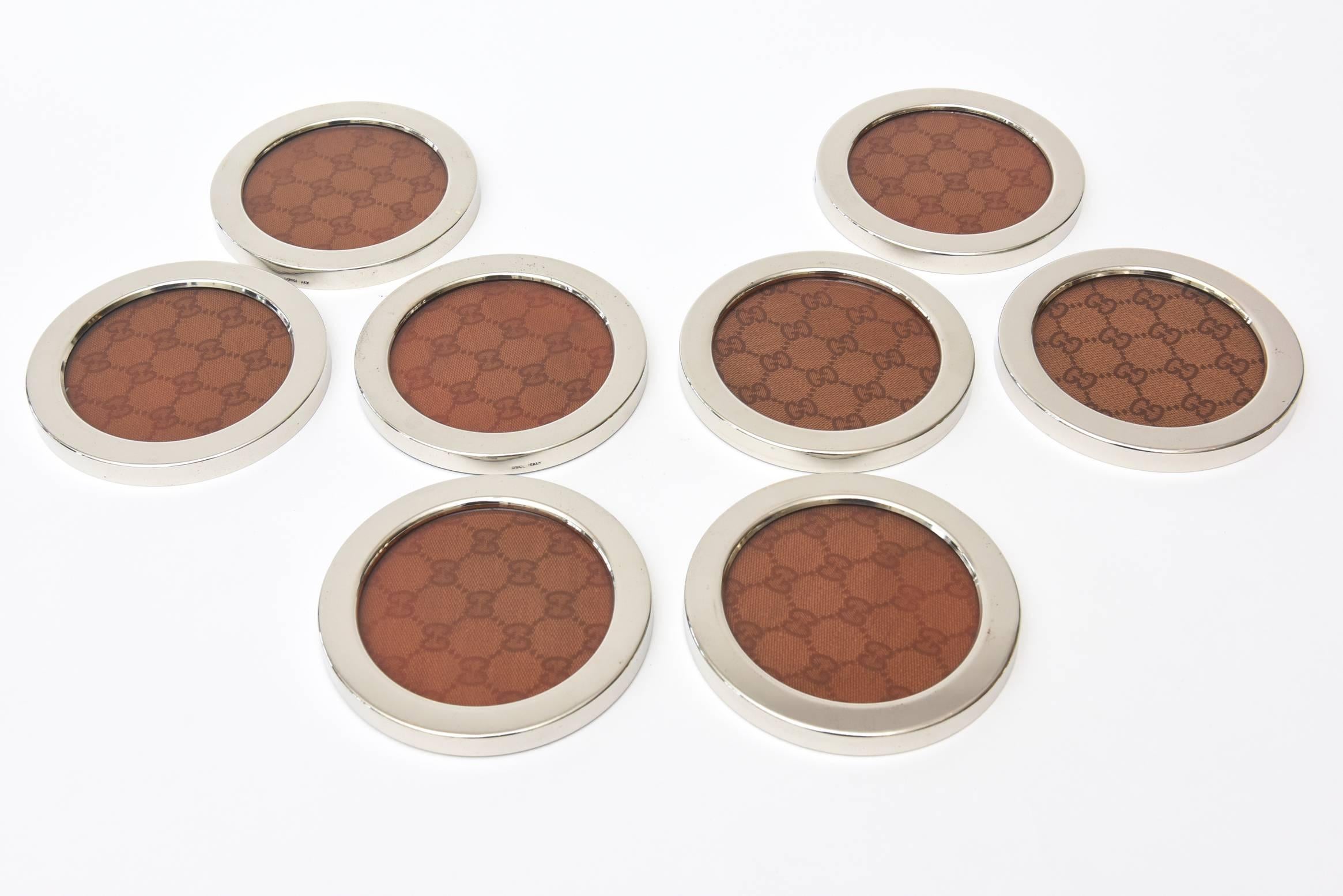 This iconic logo designed vintage Italian Gucci coasters have the outer chrome exterior banding with the logo fabric under glass.
They are marked Gucci Italy.
Please note: The chrome outer lip has been polished as best as it could be without