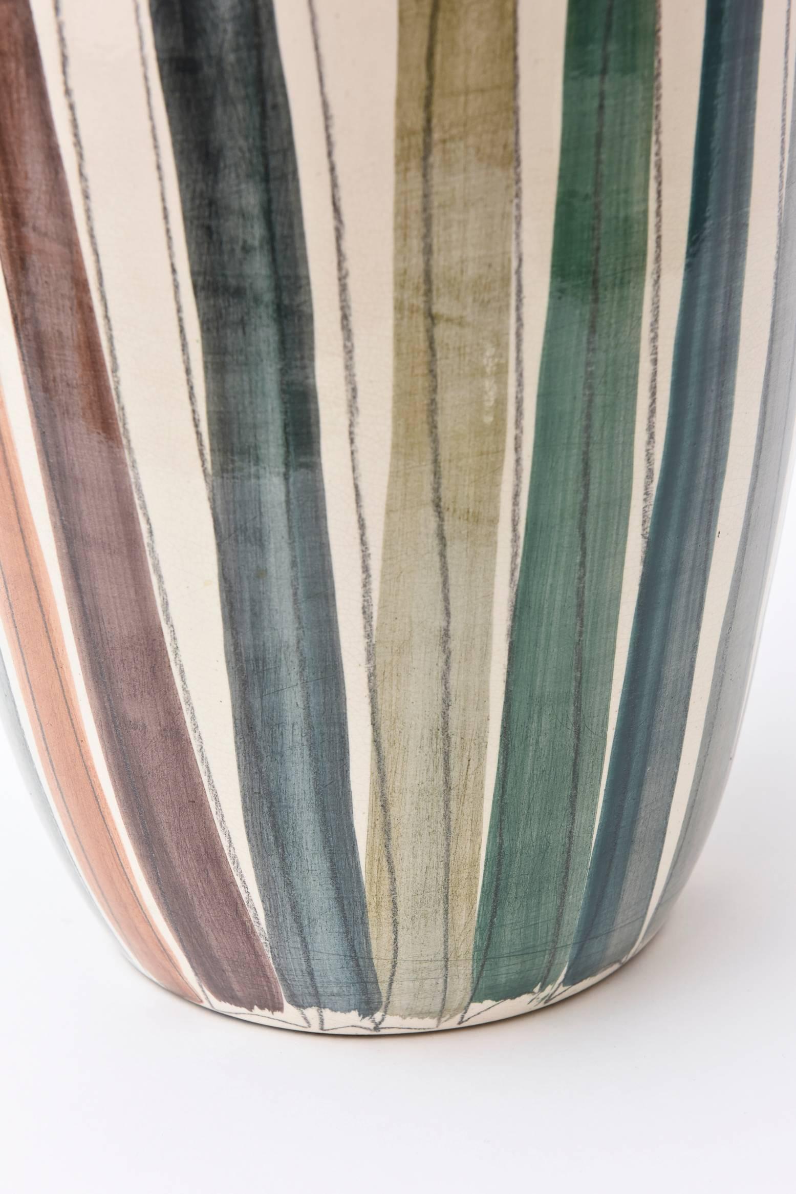 This painterly French Mid-Century large and wide vase that is signed ELC du Nord is from the northern region of France. It looks like an abstract painting of
hand drawn lines with beautiful earthy colors of aubergine, rust orange, eggplant,