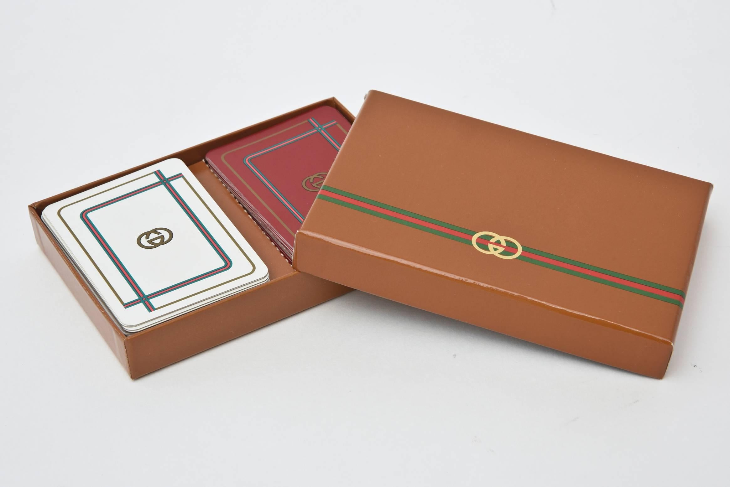 These vintage fun Gucci playing cards come in the original box.
The cards have been opened from the cellophane wrapping.
 