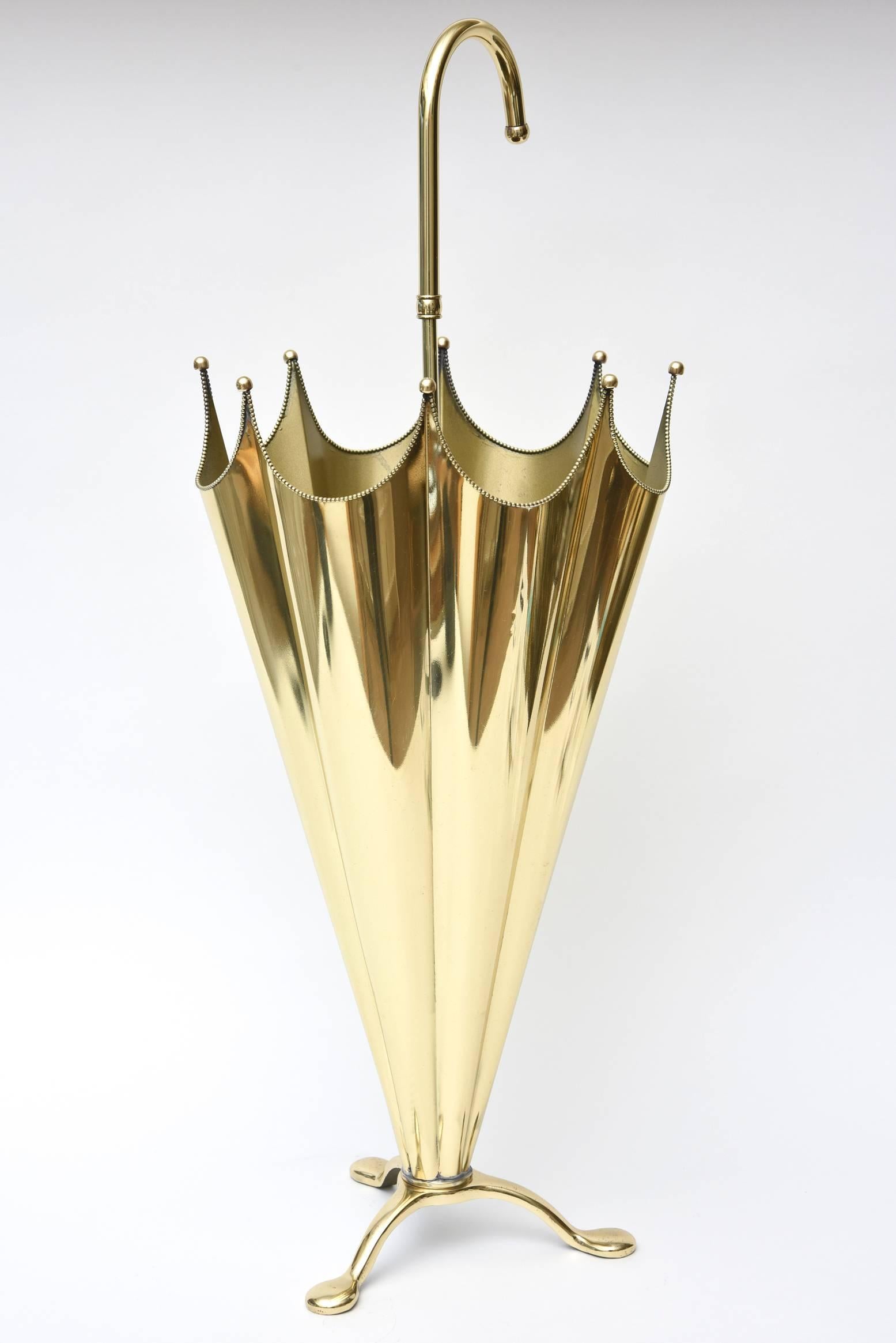 This solid polished brass Italian umbrella stand will make any door entrance/hallway stand out. It is chic and modern yet vintage. The balled brass
tips of the umbrella stand and the tiny balled scaled edges complete the form.
It is sturdy, solid