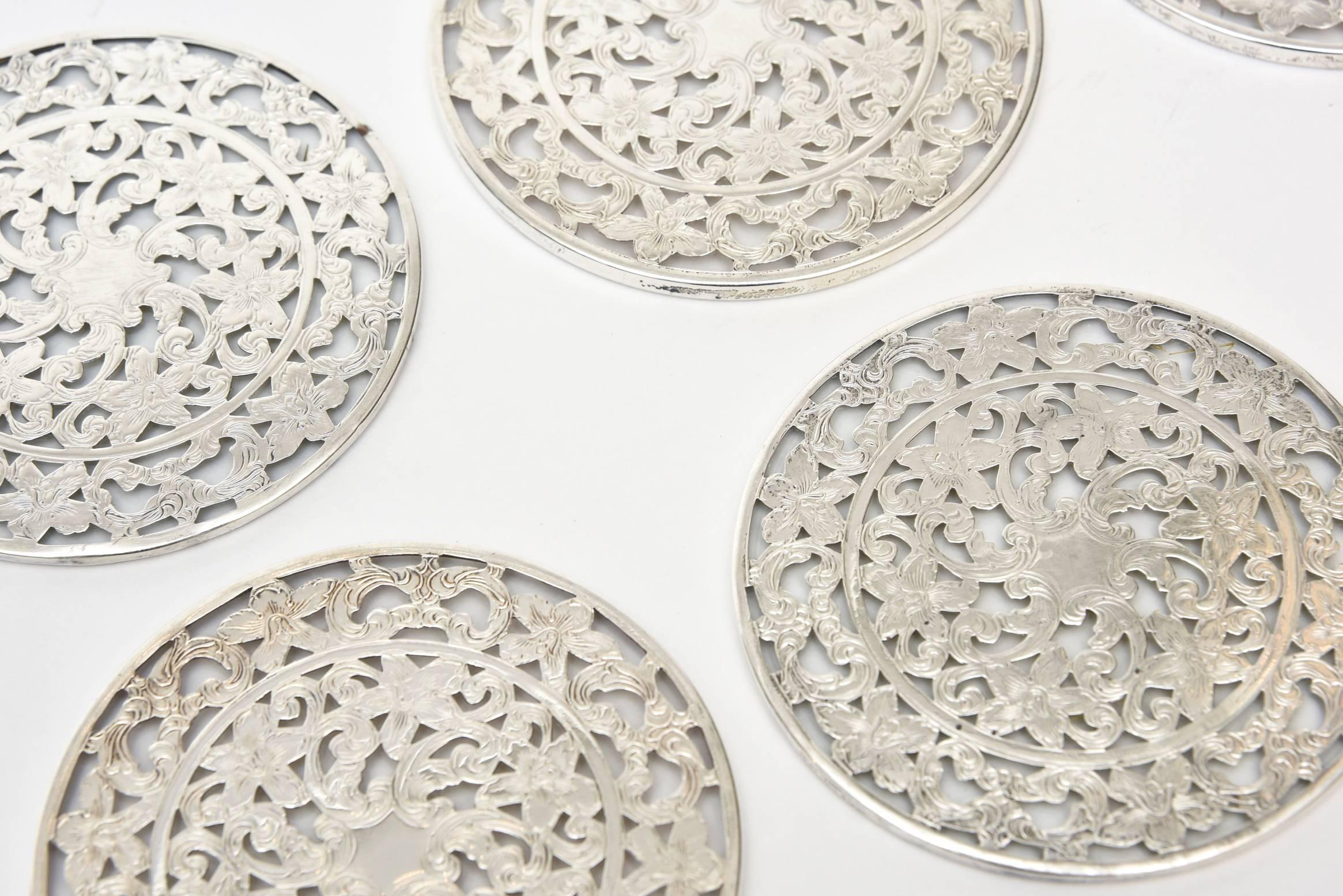 These elegant coasters are a set of six hallmarked sterling silver over glass.
They are from the 1940s and are marked Webster Sterling and in parenthesis 
WCO. Perfect for your special dinner parties.
They have a 1940s meets Art Deco look.

NOTE: