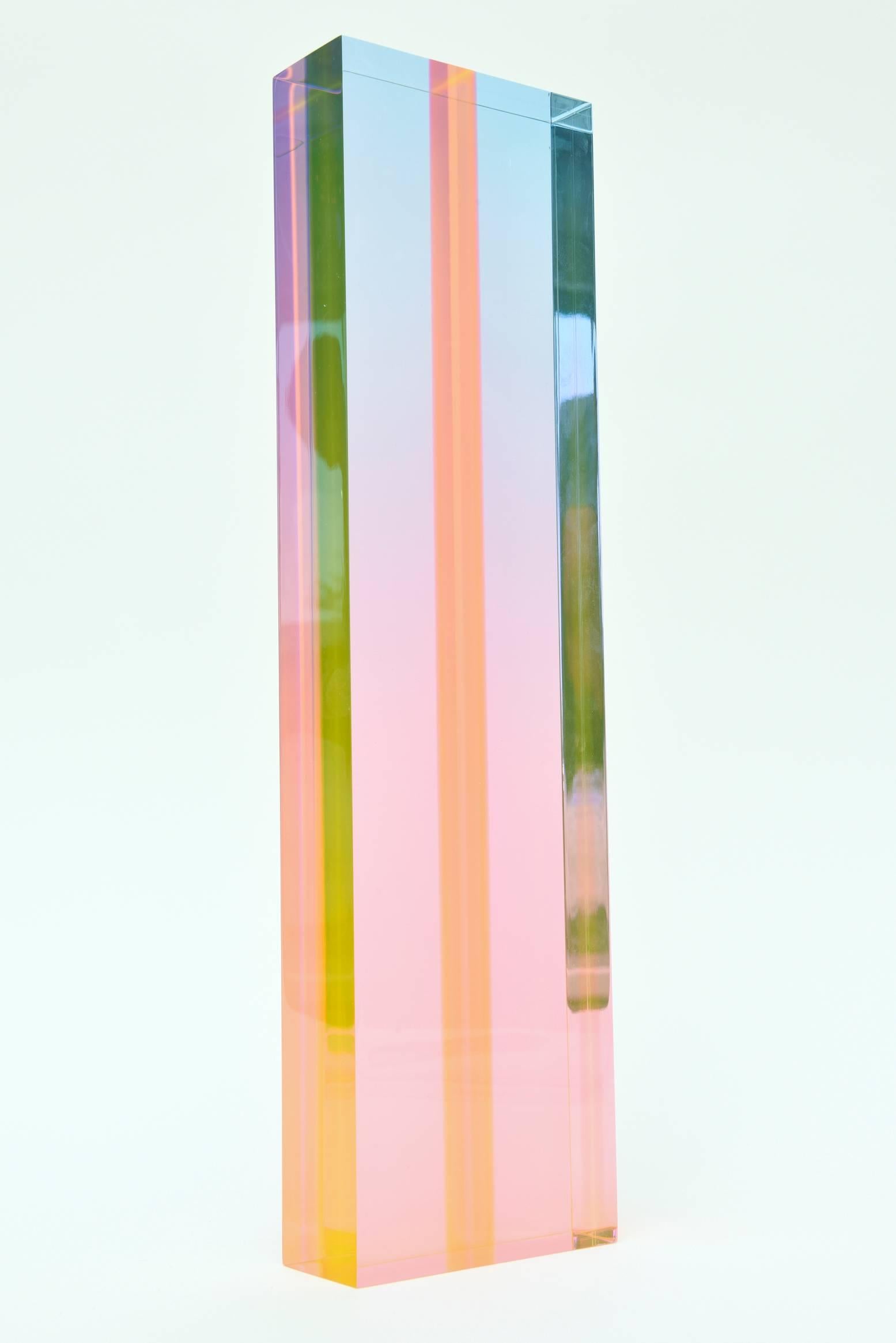 This captivating signed vintage Vasa Lucite tower sculpture is embed with beautiful and subtle planes of color that change with every angle. The colors are soft but ethereal.
It is signed vasa 77 and is entitled pastel ombre although not written on