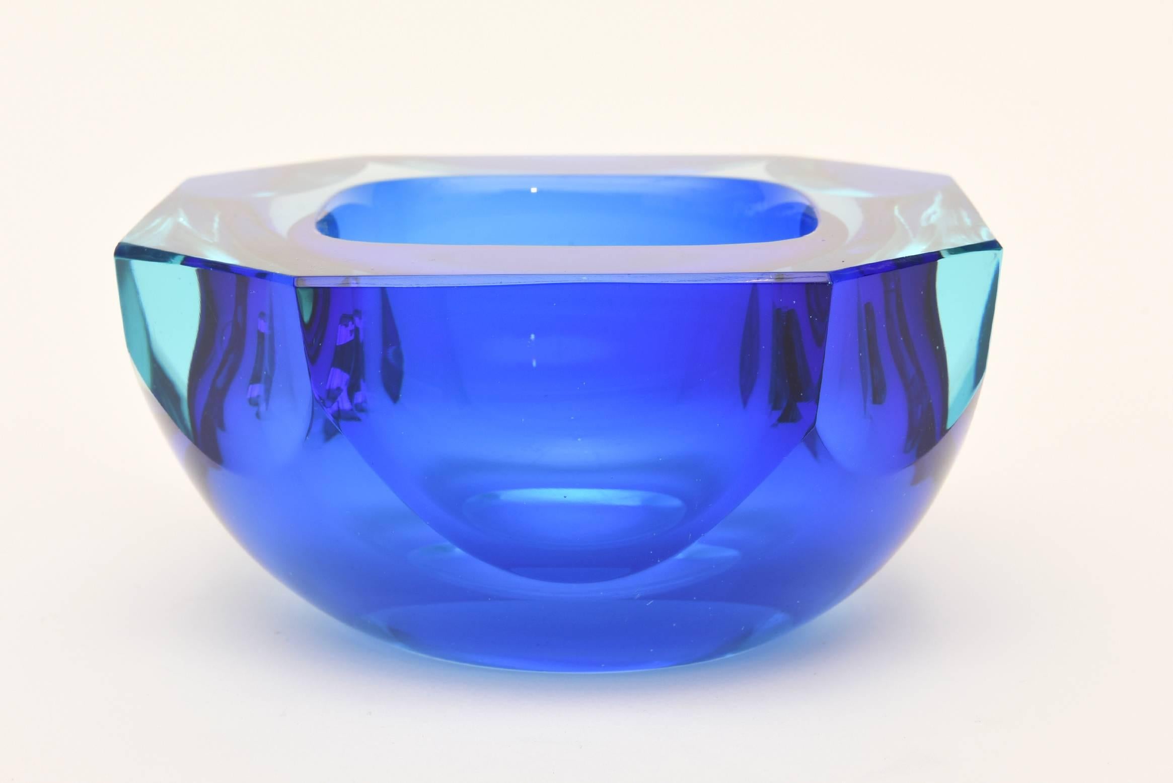 This stunning and rich color of this Sommerso Italian Murano glass bowl is vibrant and utilitarian. It can be used for serving and is also called a caviar bowl.
It has faceted sides and is flat cut on the top and sides.
It is as if you have the
