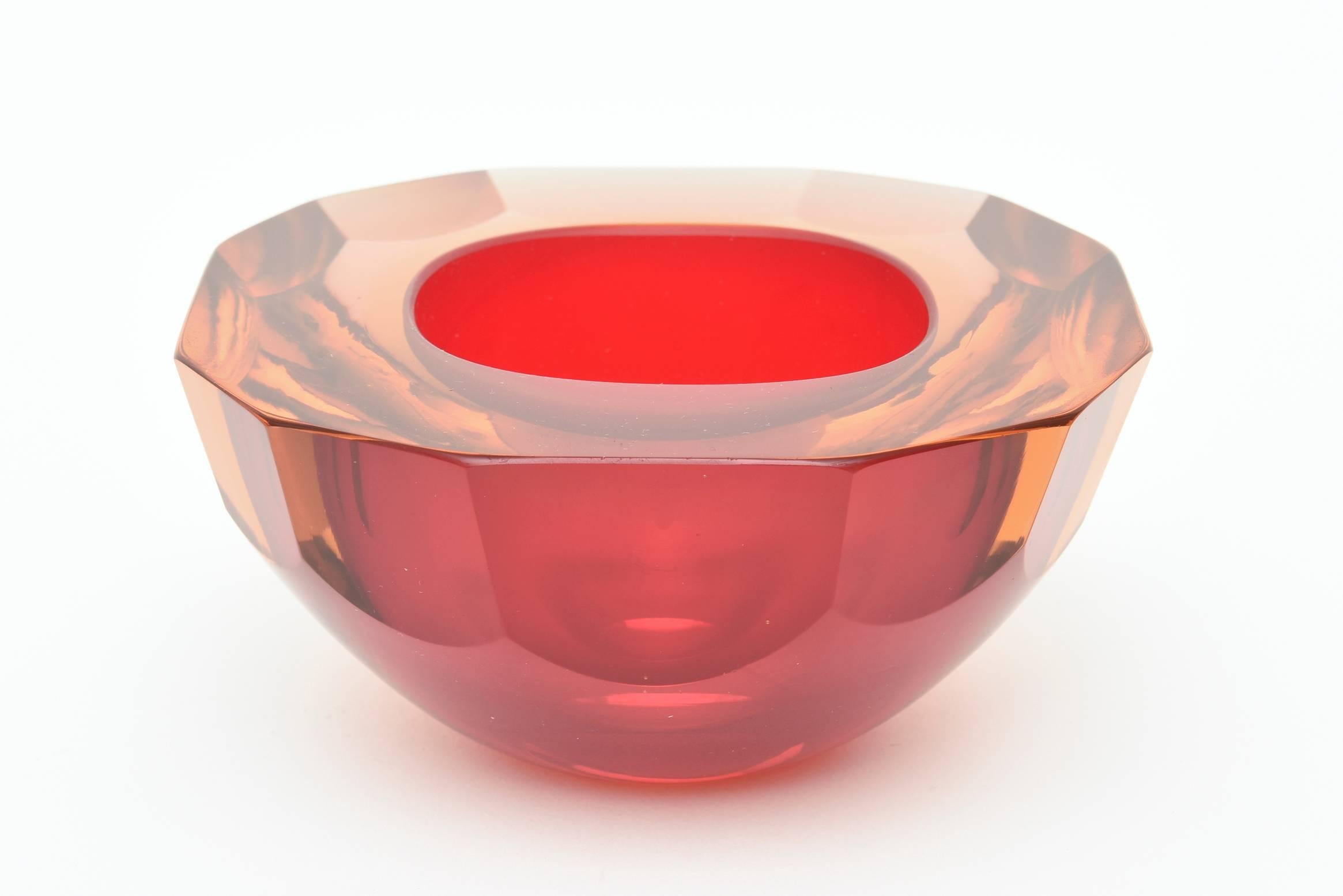 This gorgeous Italian Murano geode glass bowl has luscious vivid colors of Sommerso orange and red to amber. These are also called caviar bowls. It has flat cut polished sides and flat cut polished top
It has substantial weight and substantial