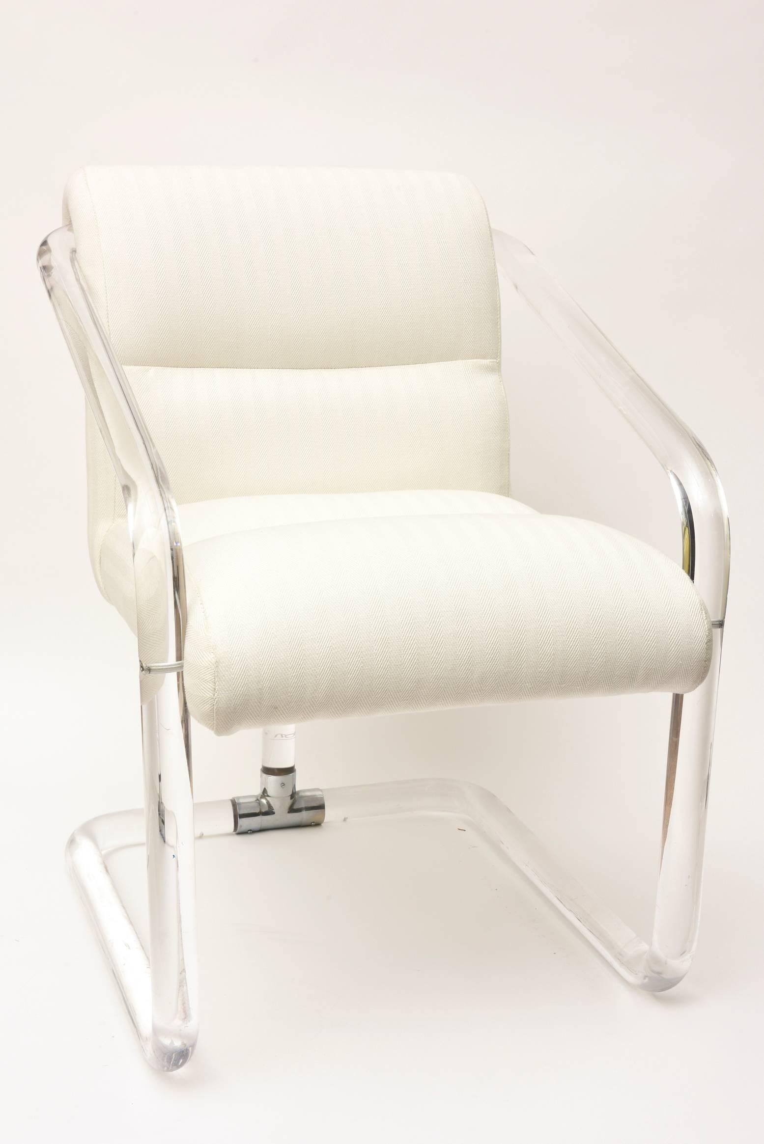 This very comfortable signed vintage Lion In Frost channelled Lucite and chrome side, desk or vanity chair is very modern.
It has been re-upholstered in a white on white chevron style fabric.
The seat depth is 18.5.
Seat height is 15.5