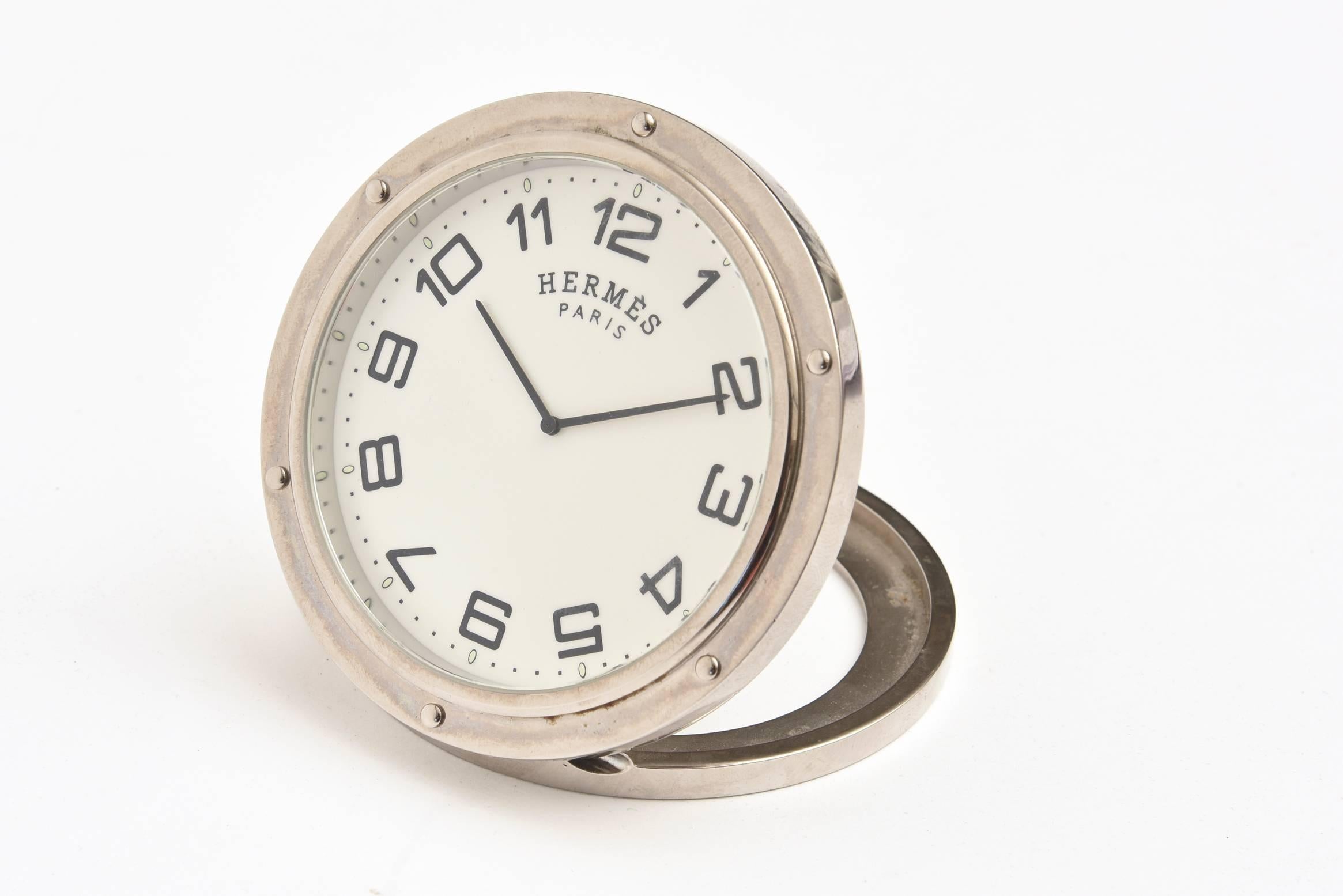 This now discontinued French Hermes travel or desk clock is ultra chic and always modern. It is all documented on the back.
It makes for a great bedside clock, desk clock and or travel clock. It is not the alarm clock however. These came in two