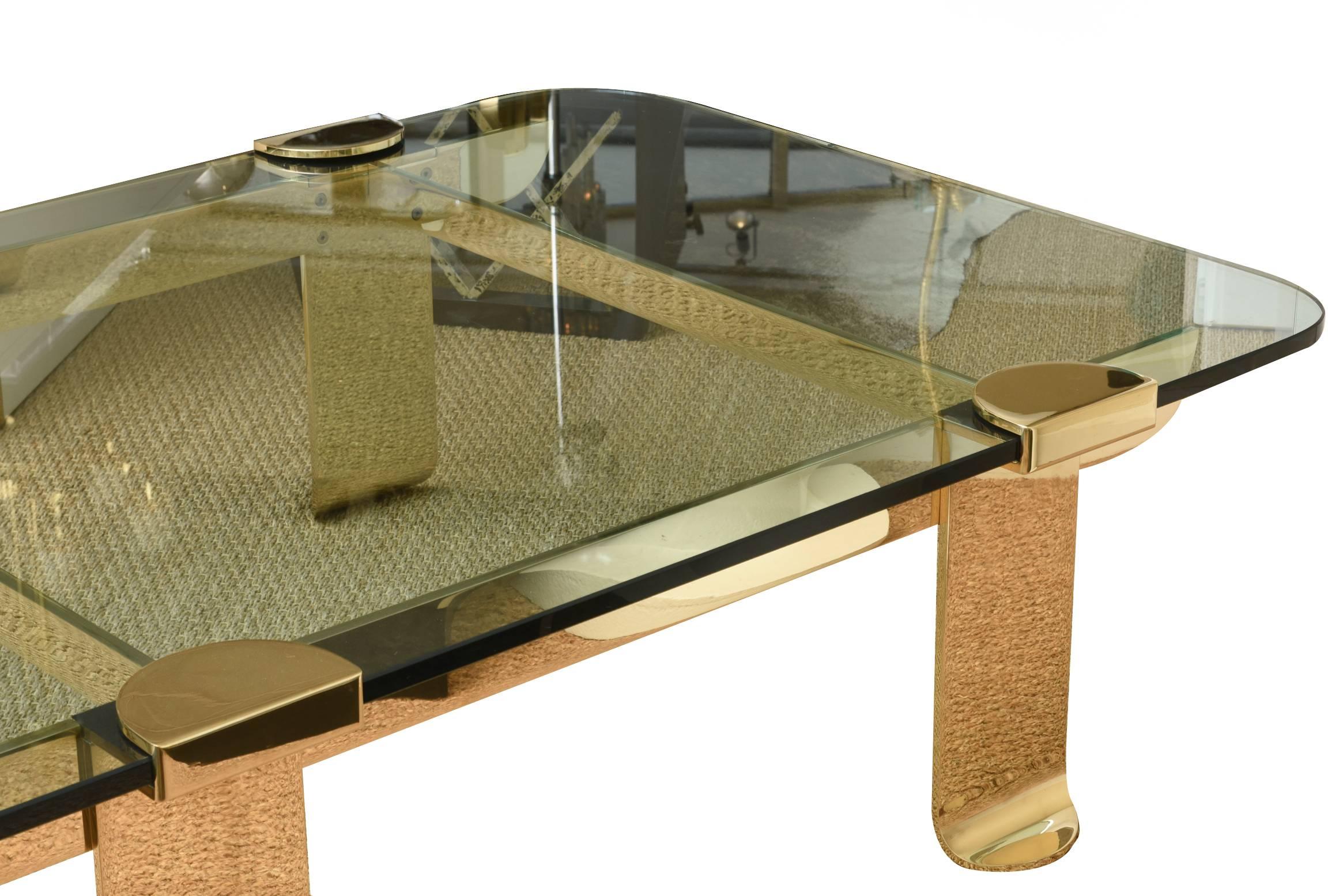 This spectacular and well-made stellar vintage Italian solid brass and glass cocktail table is one of the finest pieces of a cocktail table we have seen in a long time. The brass has been polished professionally but was not lacquered. It is European