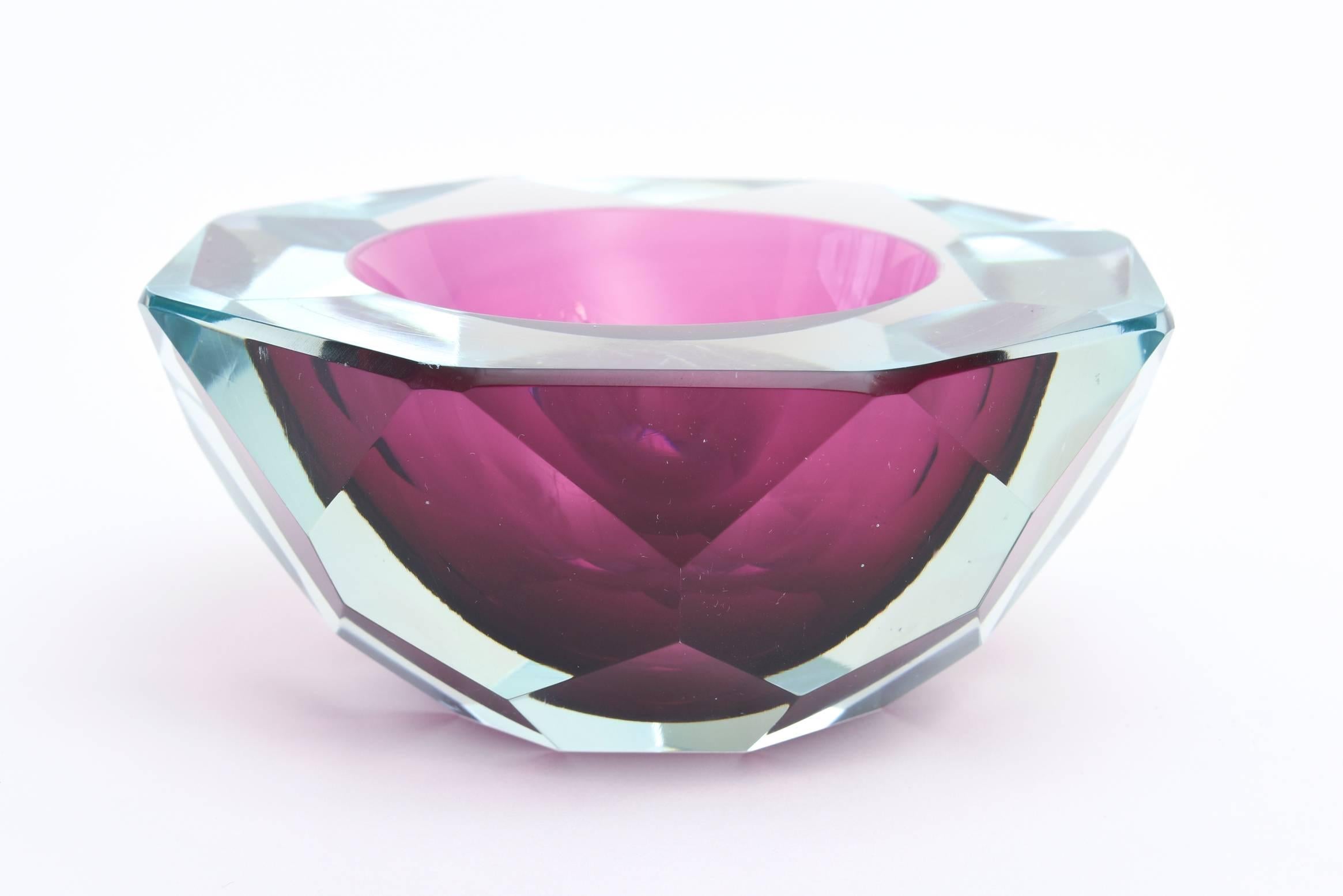 This stunning and glistening Italian Murano diamond faceted glass geode Sommerso bowl has the luscious colors of purple/magenta in the center going to a green turquoise Sommerso. It has diamond faceted flat cut polished sides and top.
These were