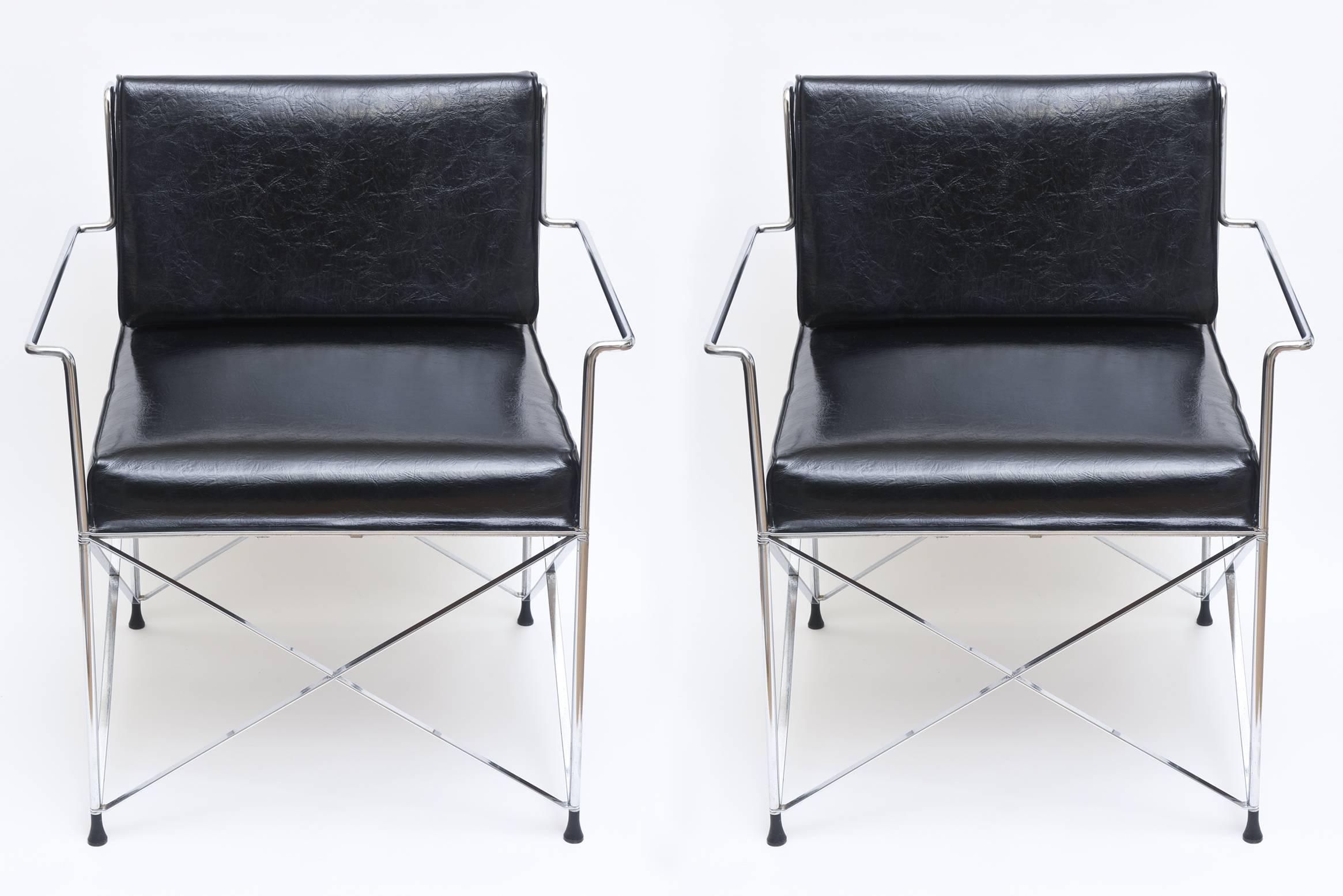 These unusual DIA; Design Institute of America chrome x frame side or lounge chairs have the original rubber tips for the bottom. The original black vinyl remains. You may want to do your own upholstery. The original chrome frames remains. These