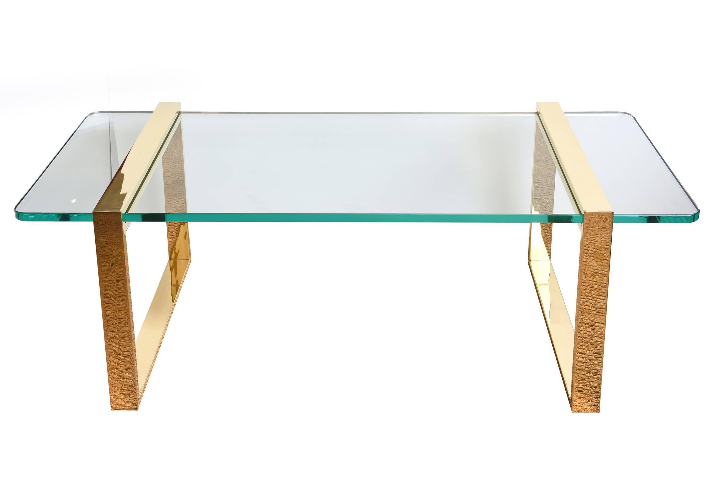 This modernist and Minimalist stunning Leon Rosen for Pace real 24-karat gold-plated cocktail table and or library table has two elegant squares that slide into the glass. They are attached and tightened underneath. This is a piece of sculpture, of