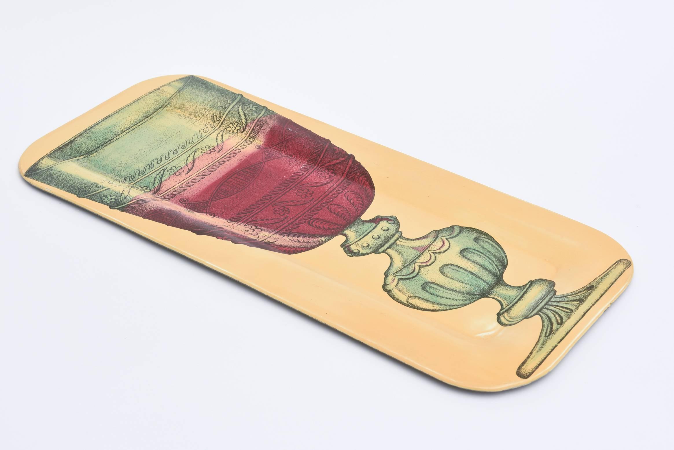 This great and rare serigraphed Italian Mid-Century Modern metal serving tray is the work of Italian artist, dreamer and genius Piero Fornasetti. This is great for barware. This particular image of this rectangle tray is rarer. It is from the 1950s.