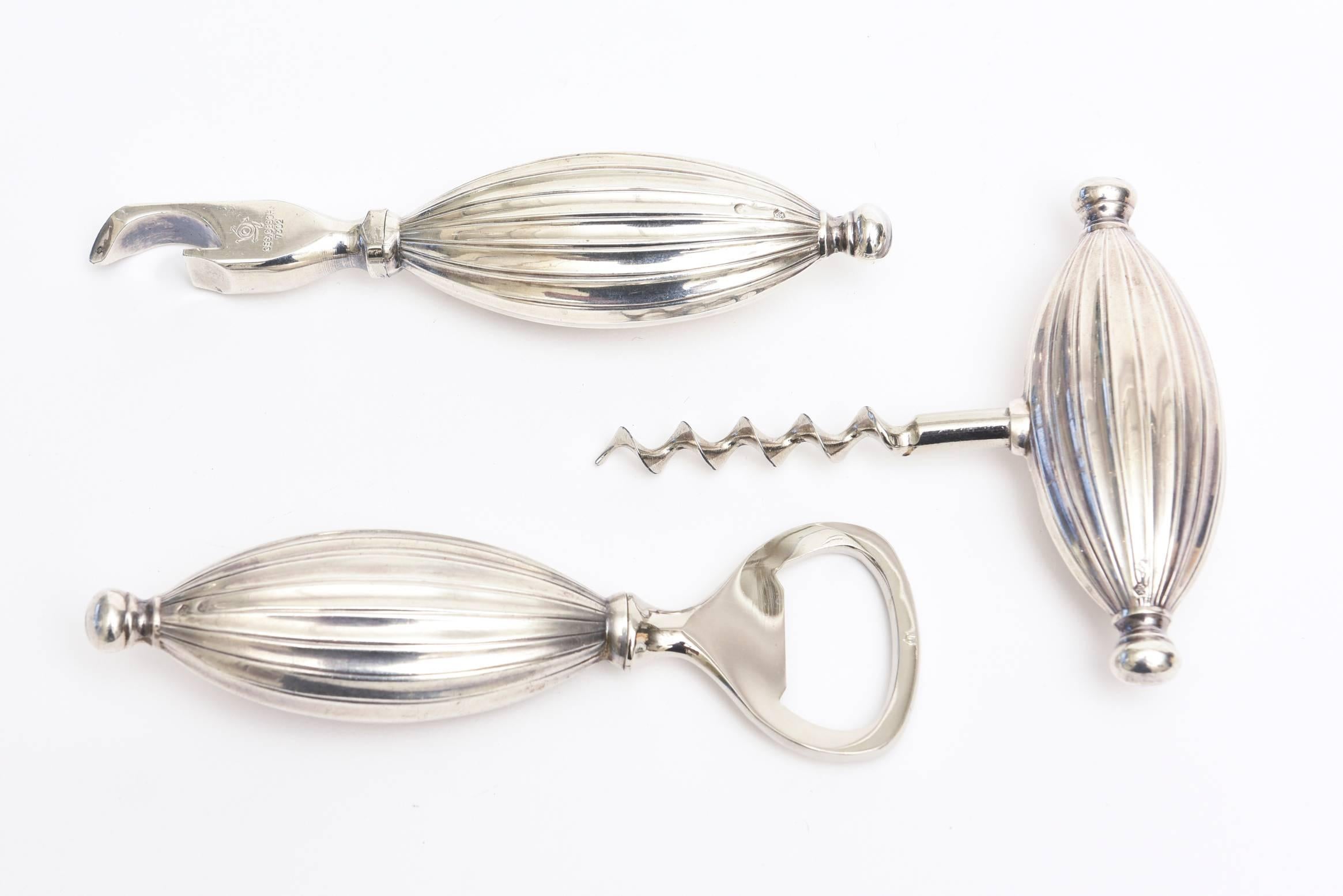 This beautiful weight German Mid-Century Modern sterling silver hallmarked and signed Ges.Gesch 7302 barware set is so gorgeous with its sculptural forms. Looks like jewelry. It consists of two different kinds of bottle openers and a corkscrew.
This