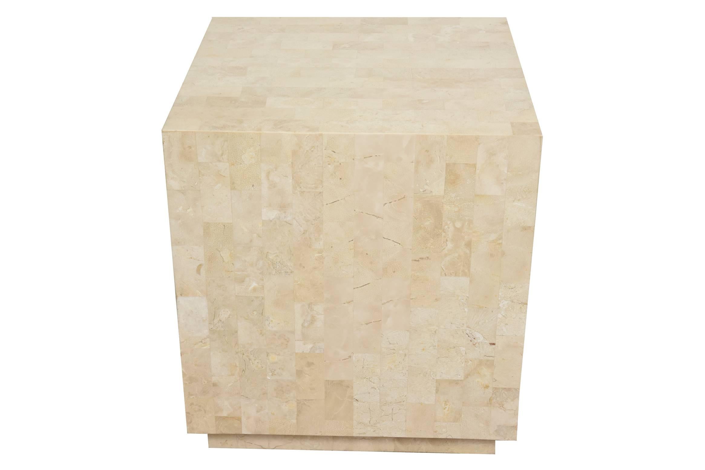 This versatile square vintage Maitland-Smith cube side table, table and or sculpture or art pedestal is tessellated stone with a recessed base. The variants of the stone color range from lighter beiges to medium beiges with off white elements in the