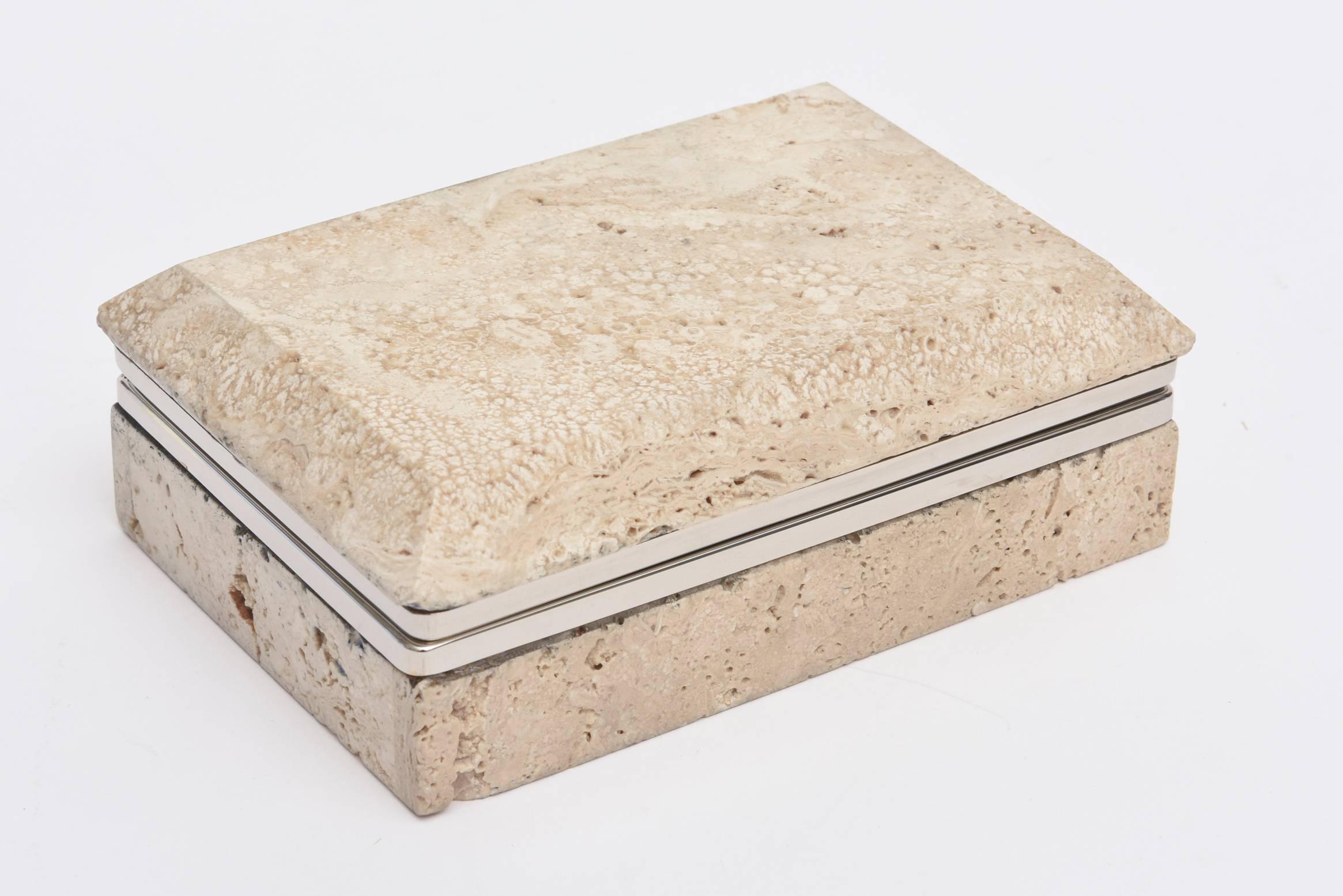 This vintage organic modern Italian travertine stone and nickel silver hinged box is a great desk accessory and or cocktail table. The metal has been polished. It is from the 1970s. The travertine has natural craters in it and on the front it looks