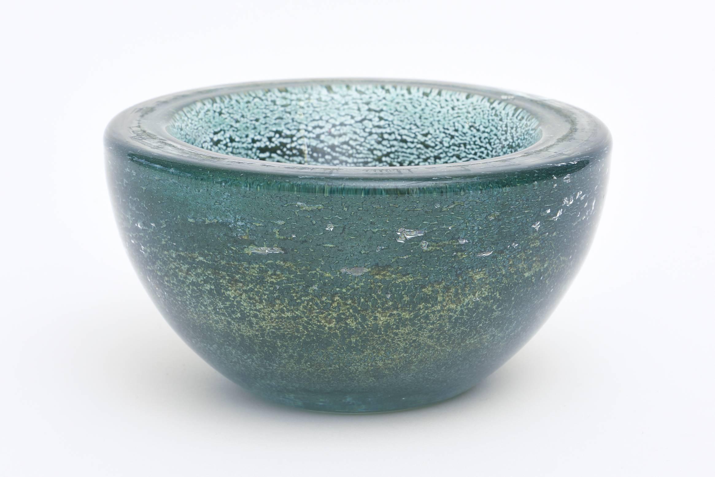 This stunning and rare Murano Mid-Century bowl from the pre-eminent glass house of Barovier e Toso has thick glass walls. The process is called Spuma d'Mare. The deep teal greens are mixed with sea foam green. This is when they were using wood