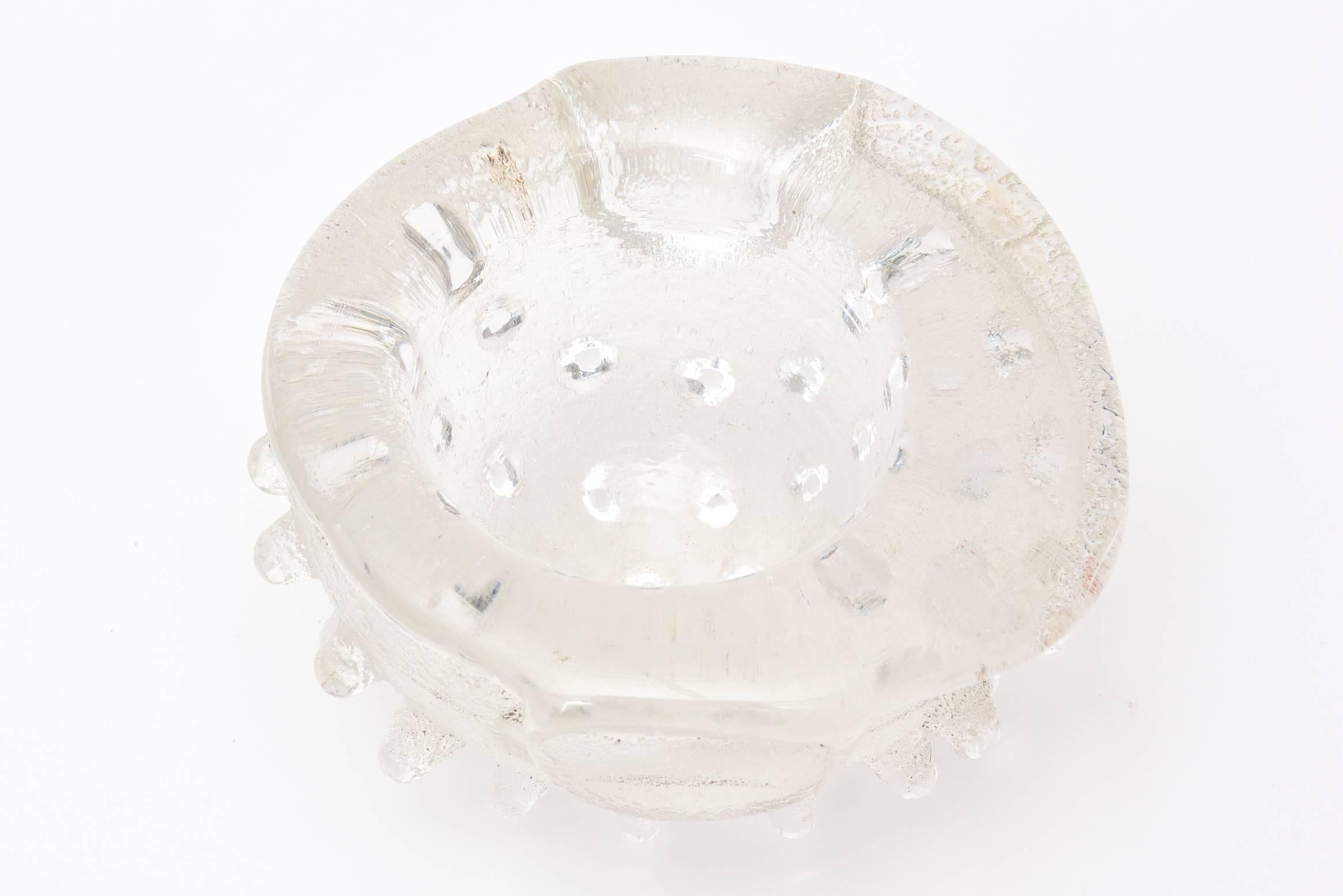 This fabulous cast sand glass bowl by David Chatt done between 2006-2008 is spiky, sculptural and just a bit off center as per the purpose. It is a work of art and one of a kind. Many were done in the series but all different. He is a mixed-media