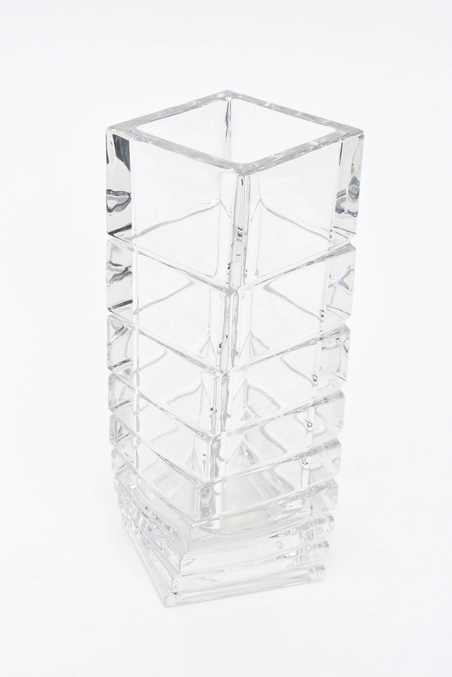 This shape and variance in this twisted and staggered Mid-Century Modern Rosenthal glass vase is usually seen in white porcelain rather than in clear glass. This is unusual now in the market. It is sculptural and architectural. Rosenthal from