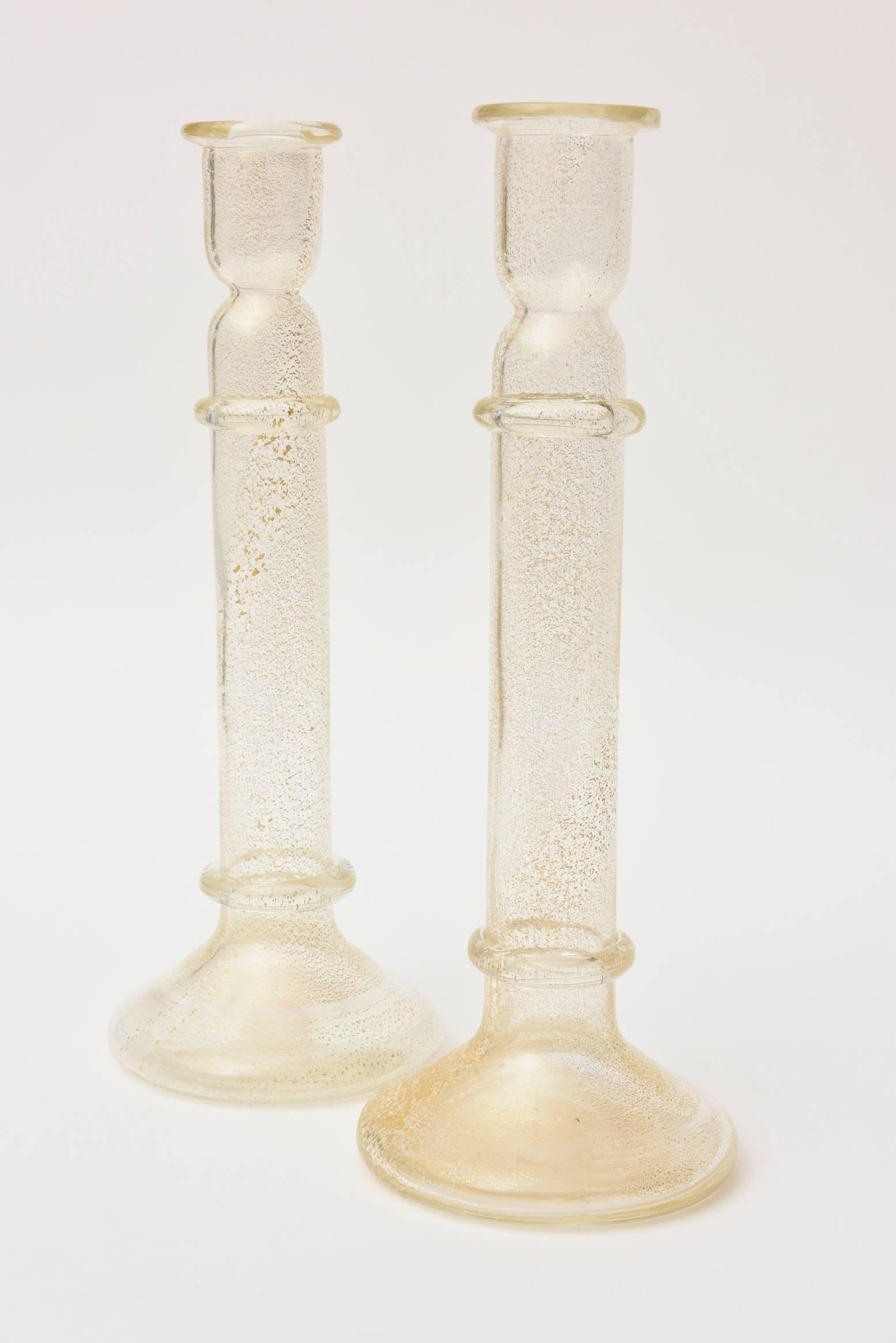 These stunning pair of Murano Barovier e Toso glass candlesticks have abundant gold aventurine interspersed throughout. They are classic and timeless.
The photos do not do justice to the beauty and simple elegance of these Murano