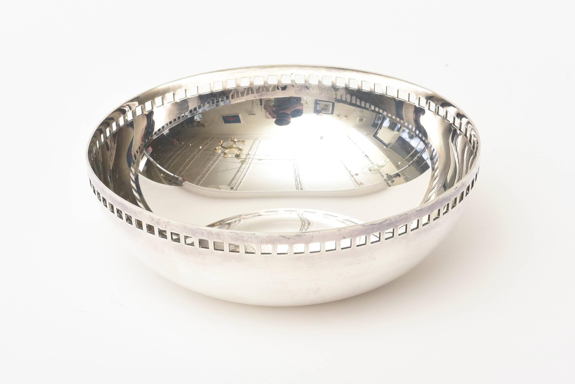 This lovely architectural silver plate bowl designed by Richard Meier for Swid Powell is called the Skyscraper.
It is modernist and timeless. Made in Italy and from the 80's.
It is a forever bowl that can be used for serving or simply