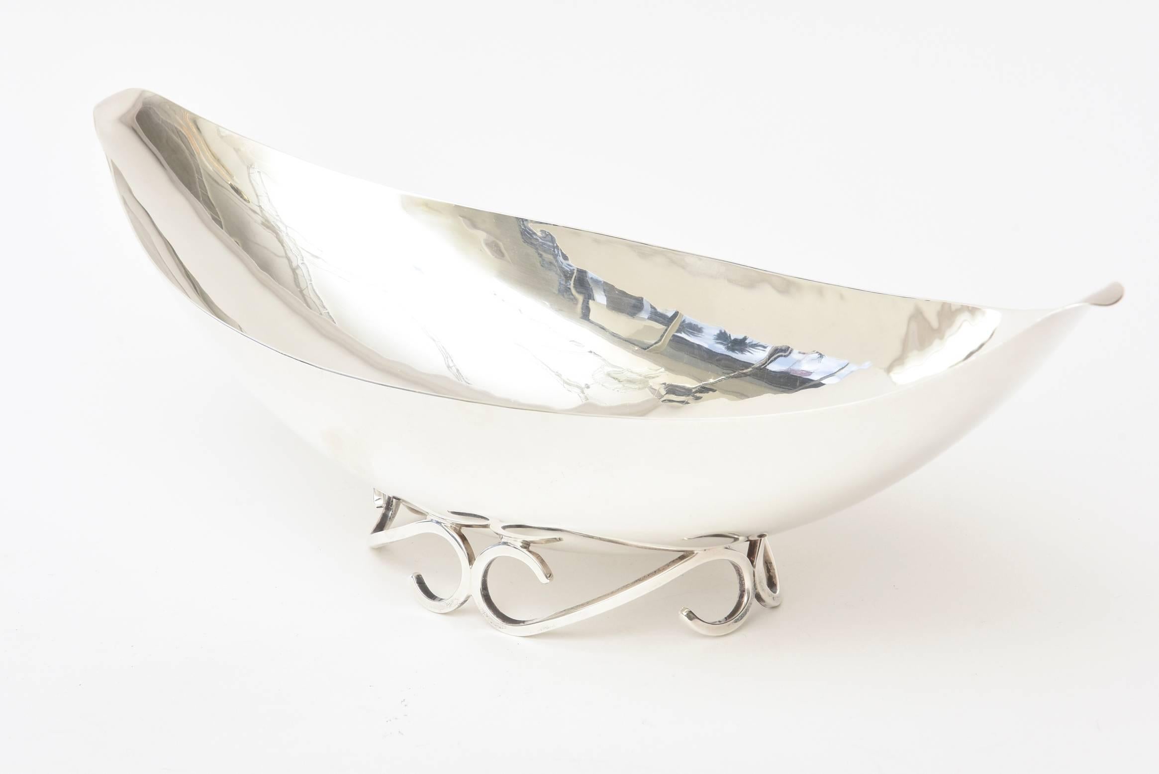 This gorgeous and period vintage hallmarked sterling silver bowl is so sculptural. It is set on a scrolled designed base. It is hallmarked in a circle; Black, Starr and Gorham, then below that 93 sterling. It has been polished as best as can be.
On
