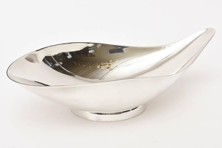 This lovely sculptural silver plate bowl marked Reed and Barton is of the period; Mid-Century Modern. Signed Reed and Barton 65 with an A insignia. The label is on the bottom. It has been professionally polished. This is great for serving, barware