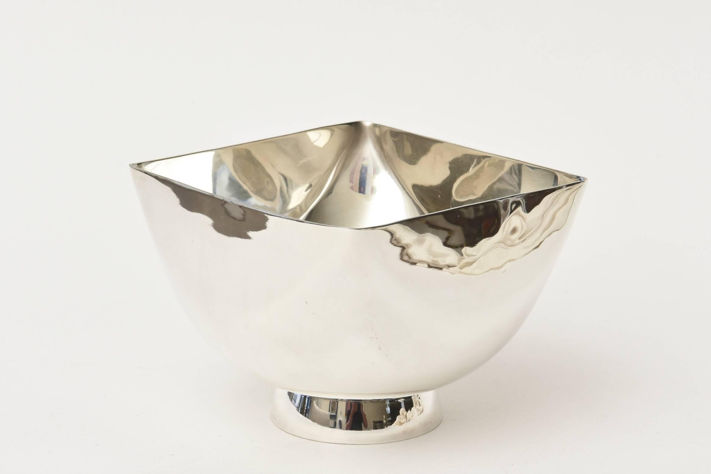 This hallmarked vintage silver plate Ward Bennett sculptural bowl is a beauty. It is newly re-silver plated. It is like a piece of fractural silver plate that catches the light. Great for serving or just as is a beautiful sculptural bowl on your