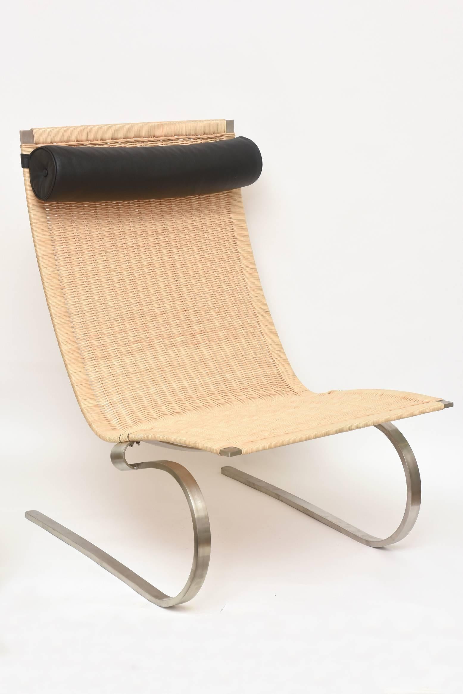 This Classic and iconic lounge chair originally designed by Poul Kjaerholm in 1967 was reissued in various formats between 1968-1980.
It is wicker cane, brushed stainless steel and has a black leather head rest bolster roll.
it was manufactured by E