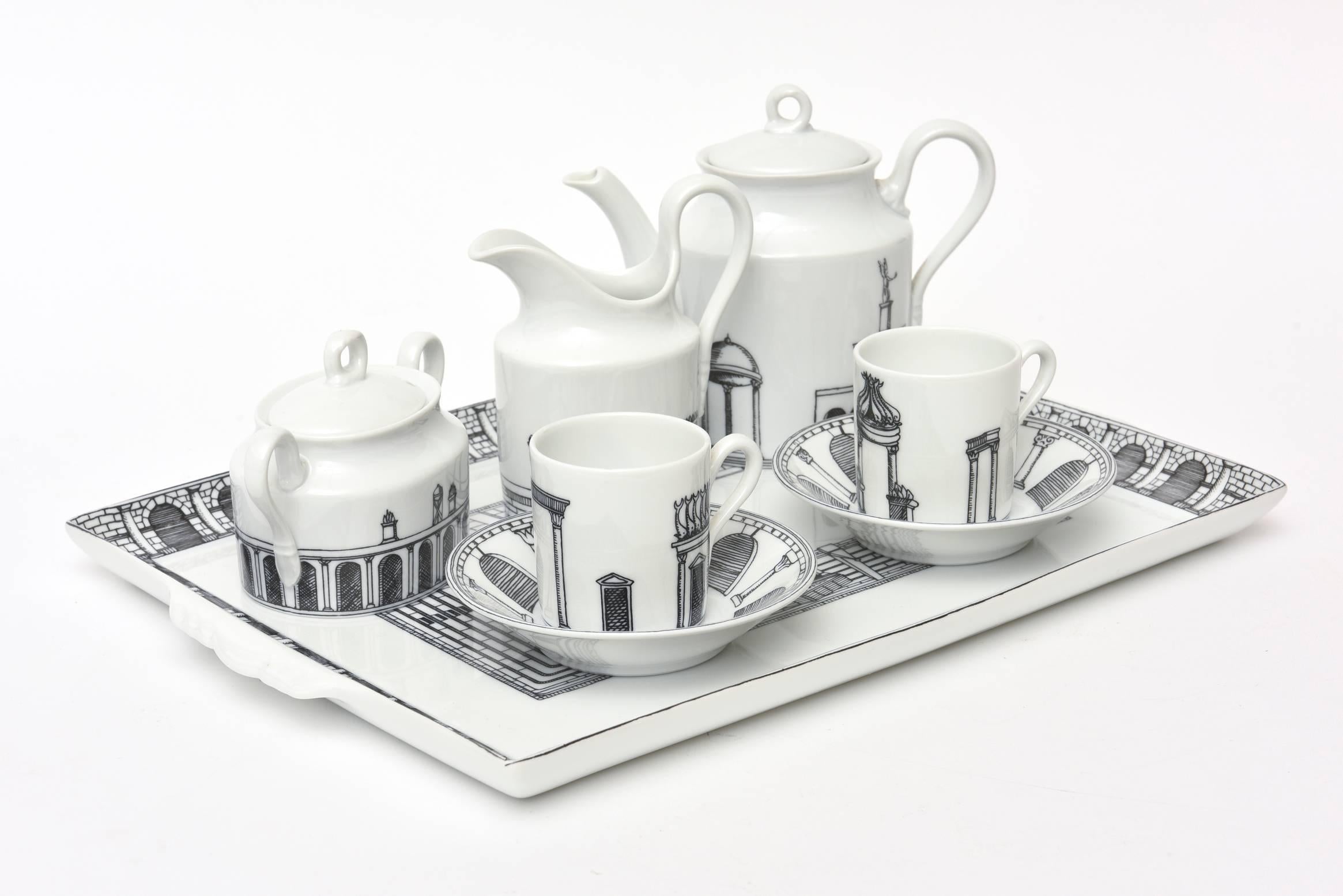 This Italian Fornasetti rare and very special architectural black and white small porcelain tea or coffee set with original tray belonged to the son of Fornasetti and was purchased from them by a friend of theirs. It is from the 1970s. It is on the
