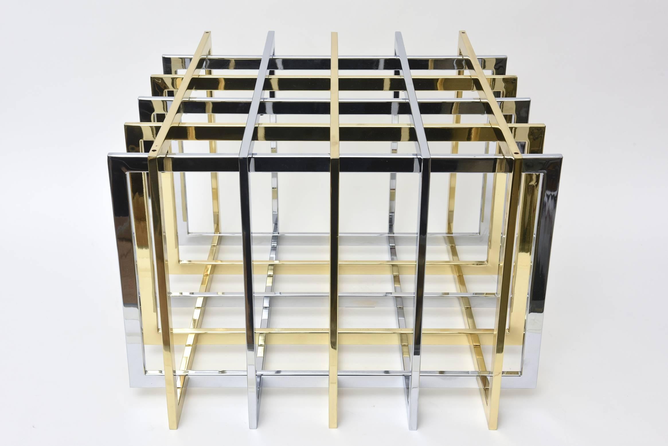 This vintage sculptural two-tone metal side table by Pierre Cardin is called the grid/puzzle table. It has been fully restored and re-plated to the best it can be given the age. It is chrome-plated and brass plated over brass. Still remains modern