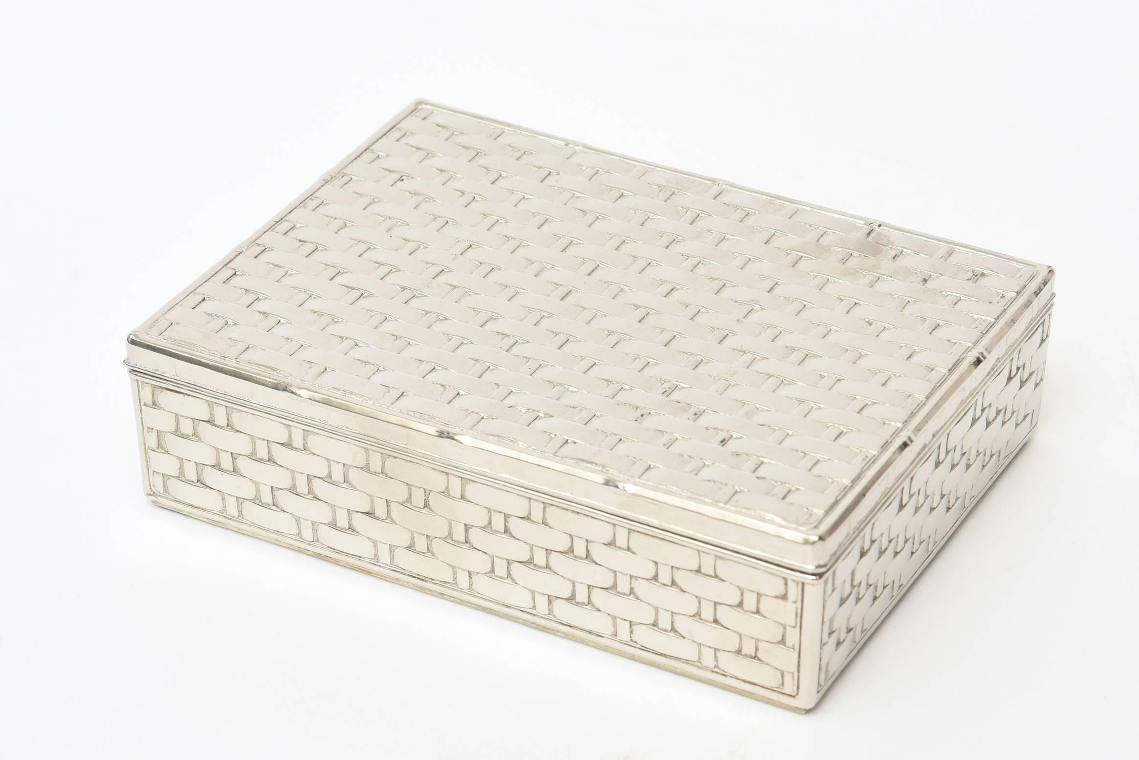 This lovely vintage hinged French silver plate box by Creation Marcel Rochas is a beautiful basket weave of silver plate design with textural dimensions. It has been re-plated. This is great desk accessory, or for a coffee table and or console. It