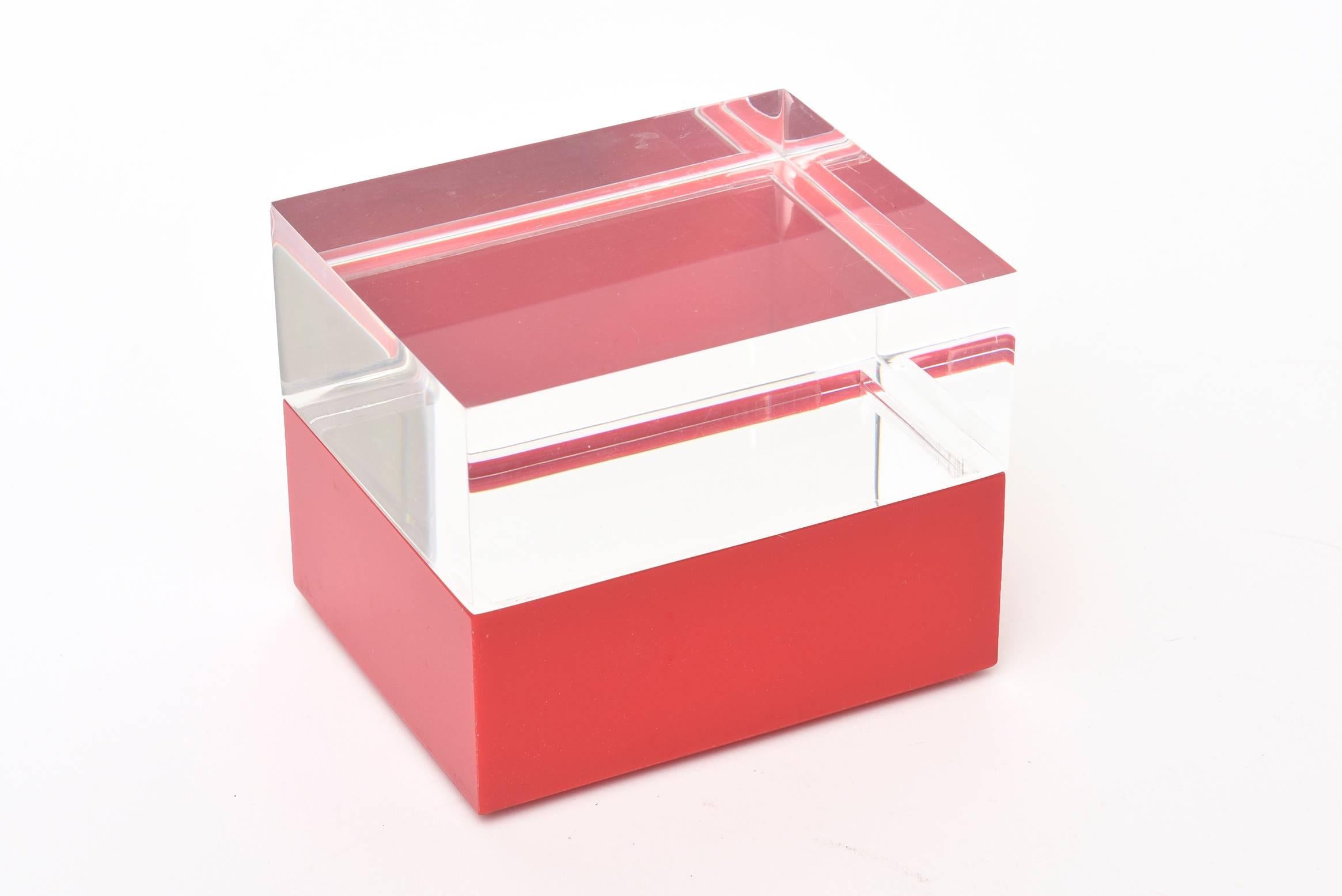 This two-part red and clear Lucite vintage Italian box has been attributed to Alessandro Albrizzi. It has the plastic label of the store that is was sold at on the bottom.
Clear top, red bottom. This makes a great desk accessory and is a happy
