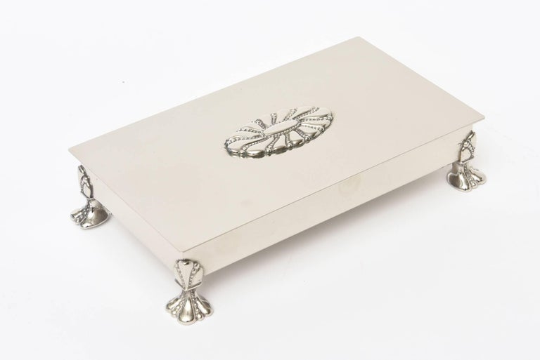 This lovely restored silver plate hinged box and or cigarette box is from the 1940s and hallmarked on the bottom 