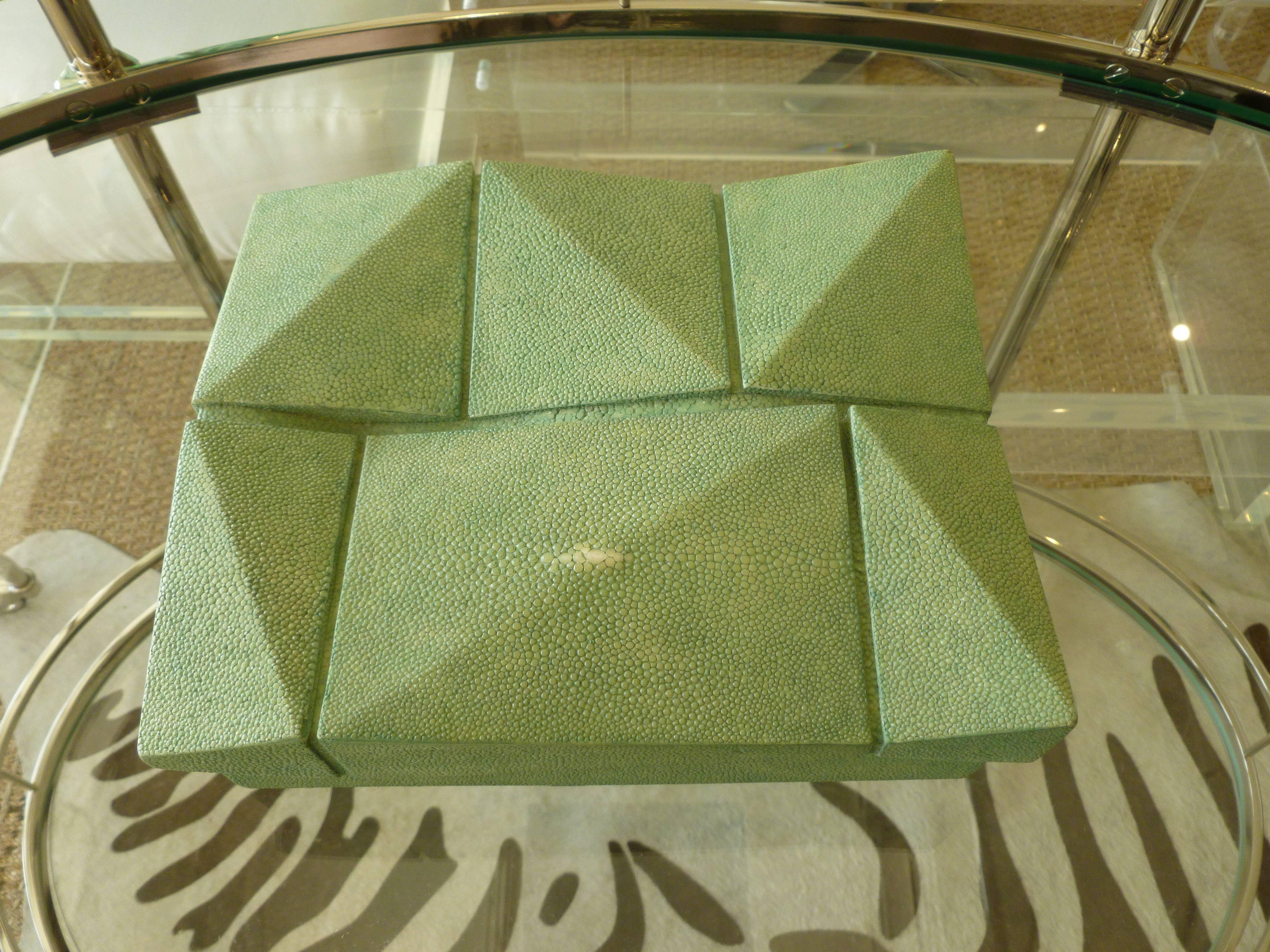 This gorgeous R&Y Augousti 2 part box is shagreen and has a sculptural top.
The interior of the box is wood. The color is tranquil and the box is fabulous!
It is from the 90's. Textural and sculptural.
The R& Y Augousti husband and wife team