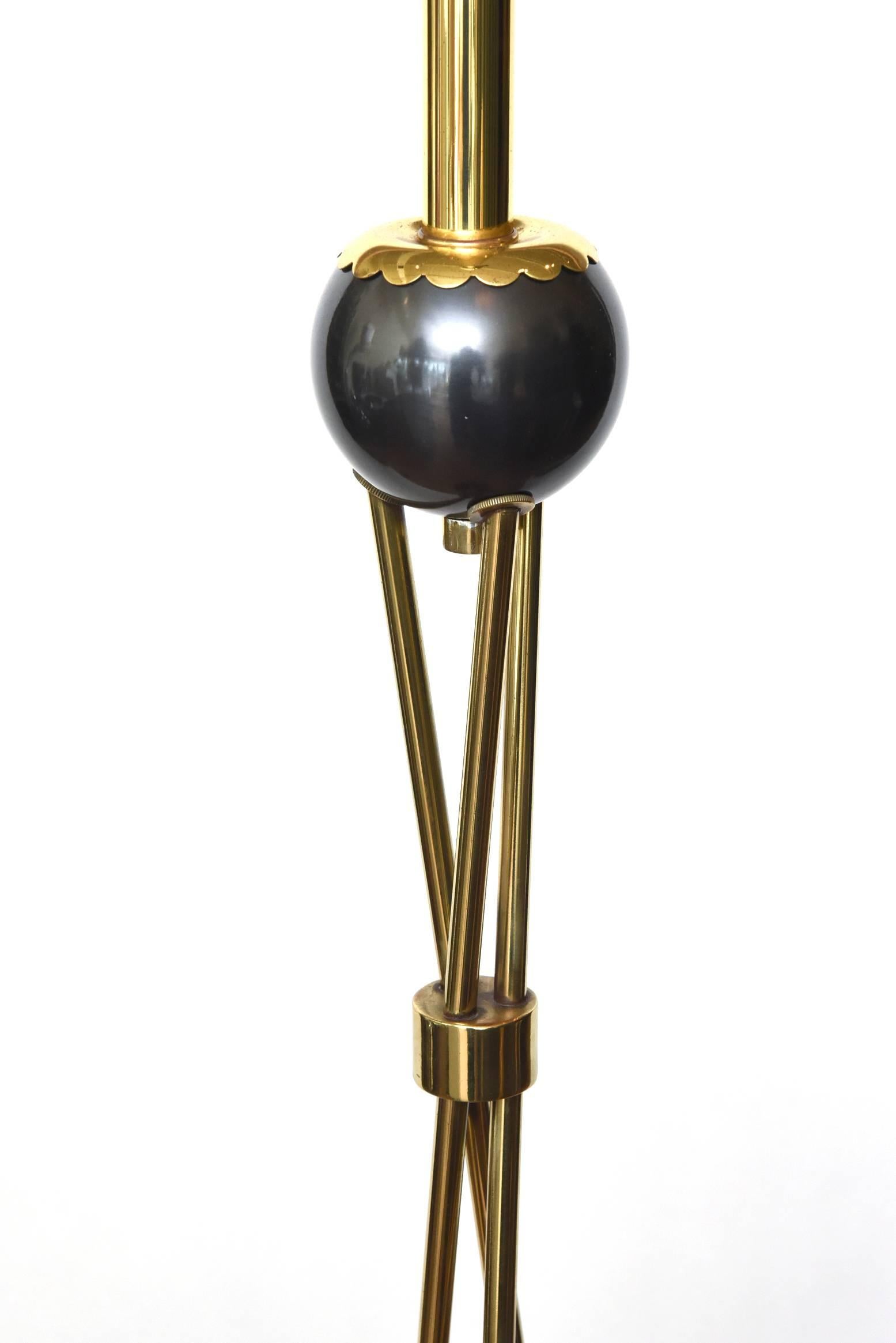 This vintage and fully restored Mid-Century Modern floor lamp is a combination of polished brass and gunmetal. It has been rewired and just needs a great drum shade at your end with a glass bowl. It is modern yet midcentury. It looks French yet is