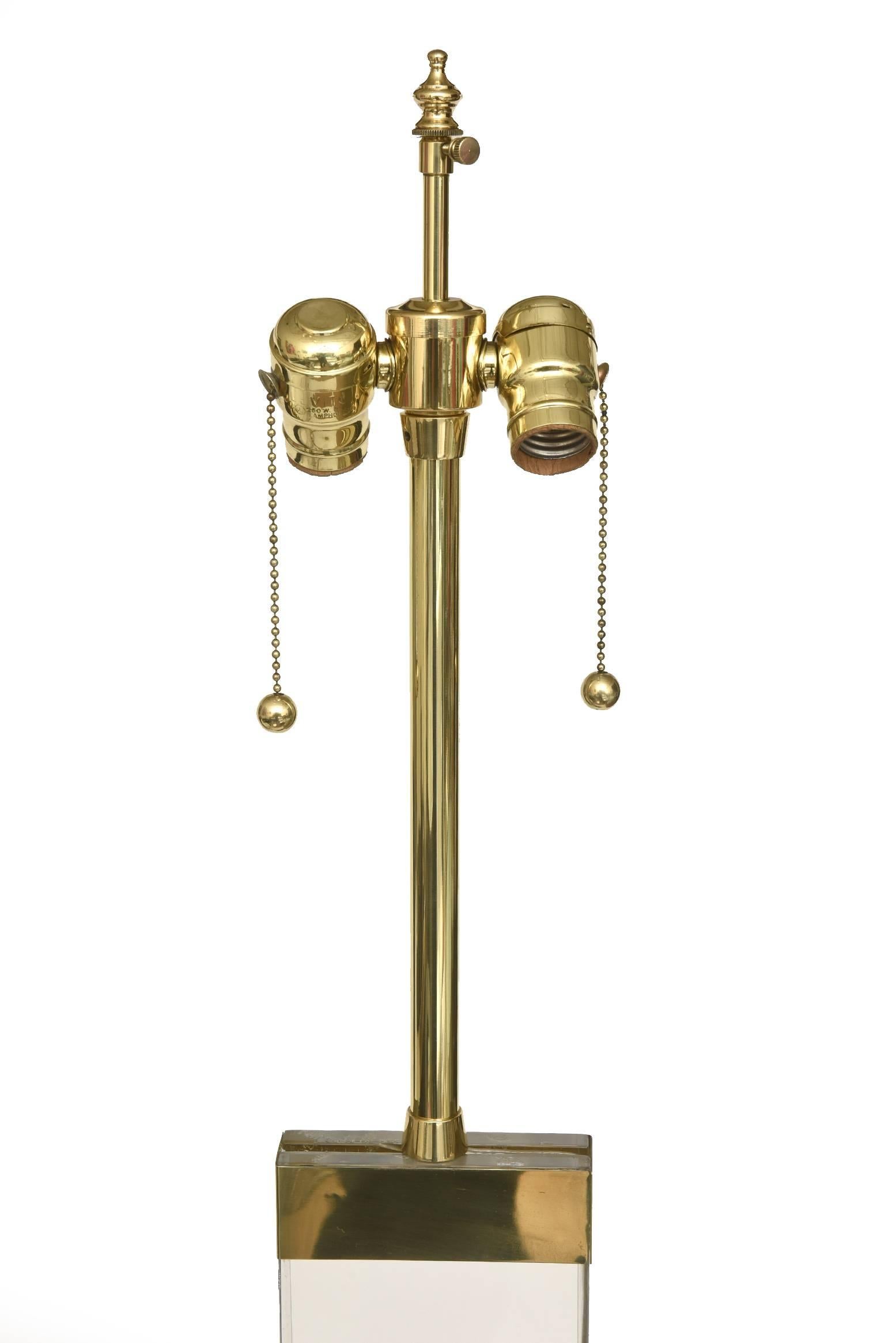 This fabulous restored vintage column floor lamp has two appendages of ram's heads on the sides. The components are brass and lucite. It has been restored to the best it can be and rewired. It was also polished. It does not have a shade included.