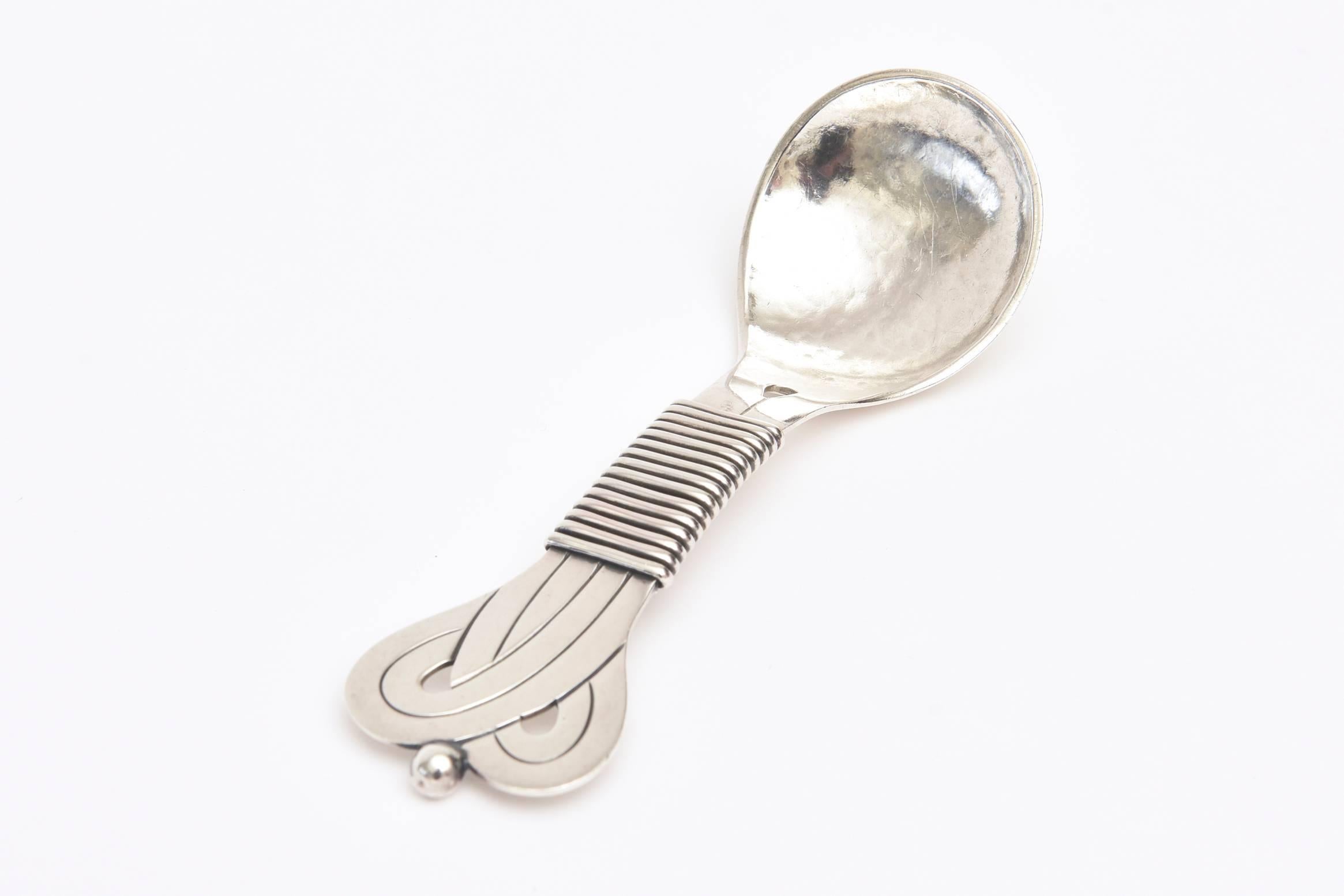 This modernist and Sprawling inspired hallmarked sterling silver gorgeous serving spoon says on the back