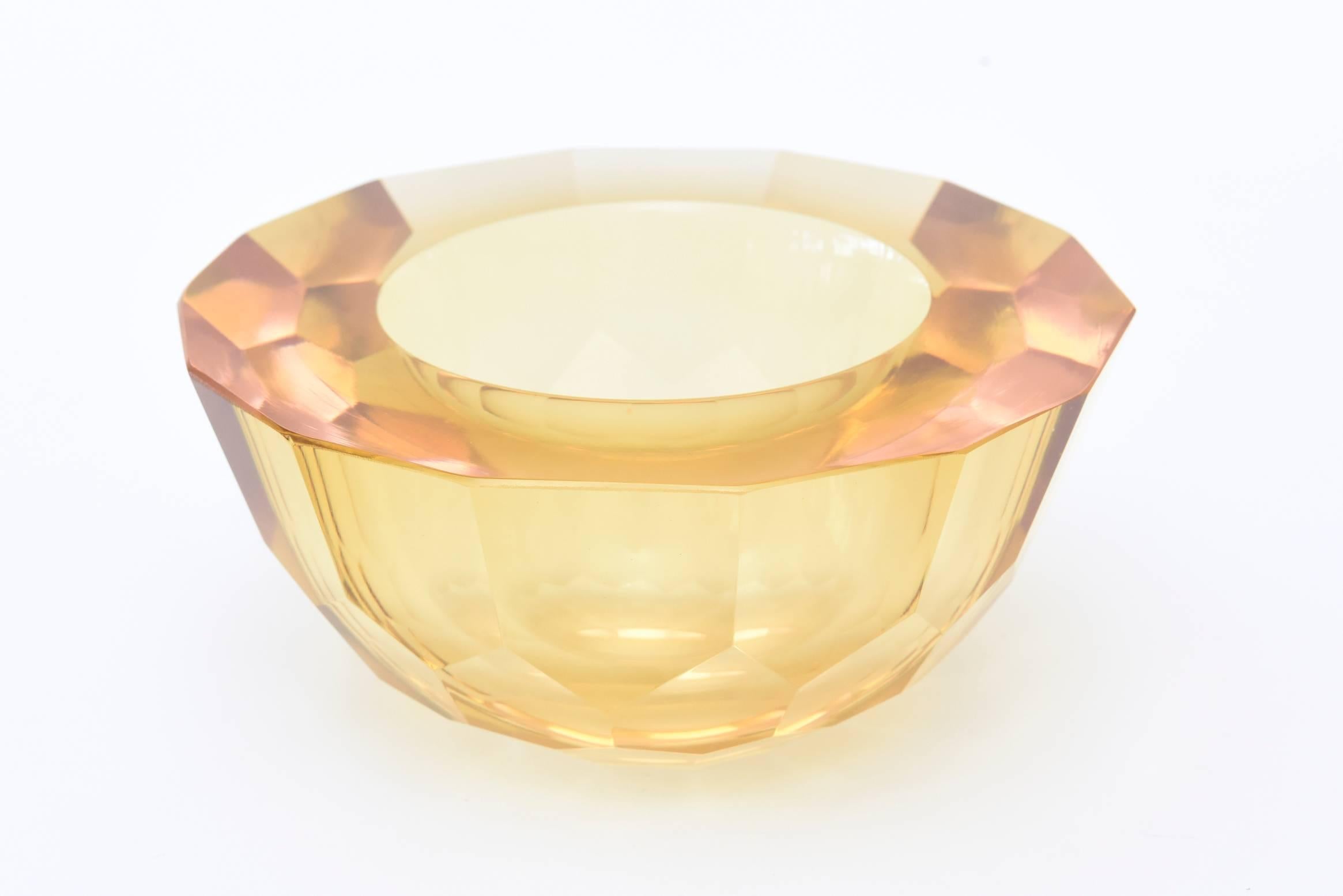 This stunning large Italian Murano handblown diamond faceted flat cut polished glass sommerso geode bowl has an unusual palette of color. It is yellow to amber with hints of pink to peach to blush peaking through on the top. With the play of light,