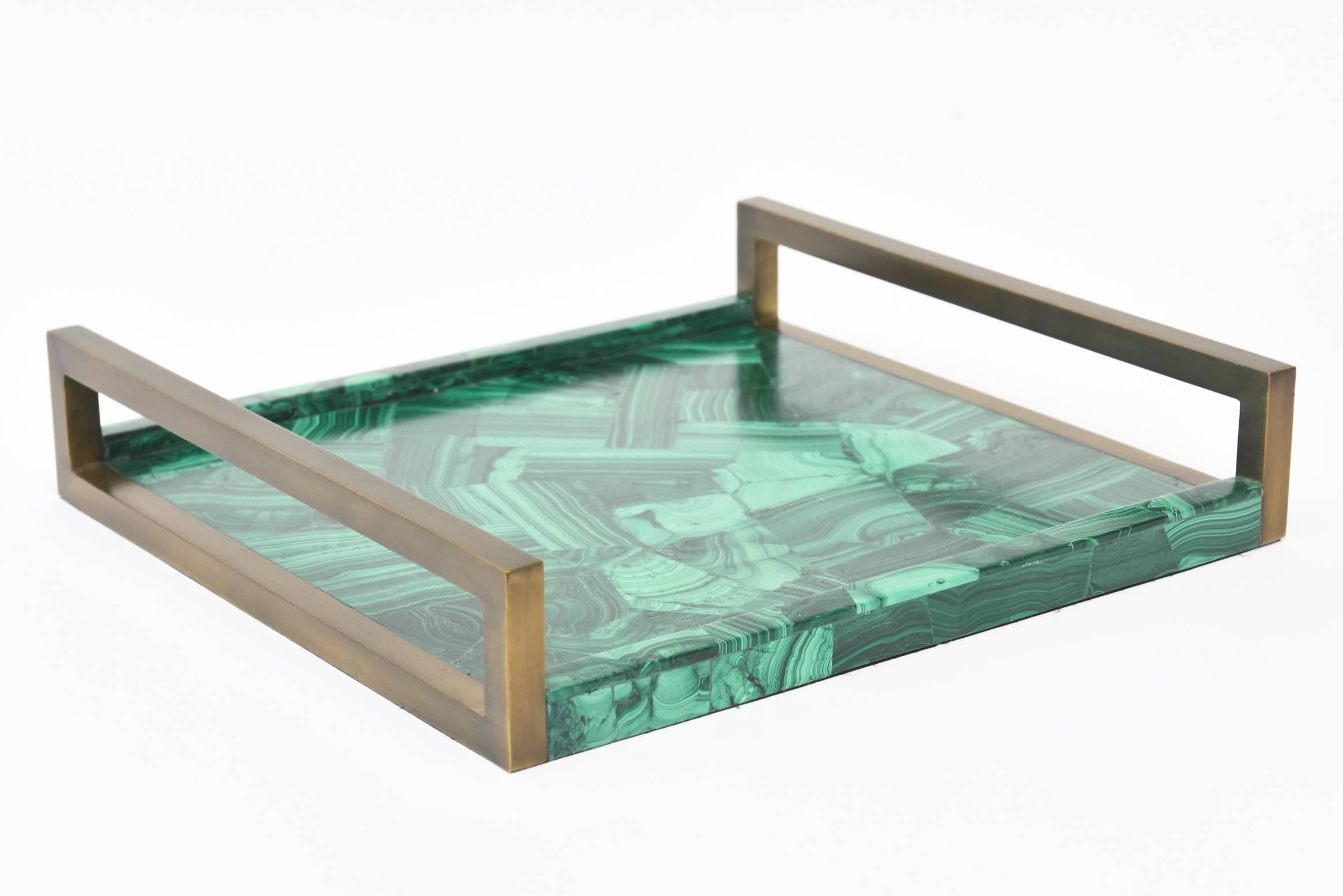 This ultra-chic R&Y Augousti tray has oiled brass darkened handles with faux malachite tessellated composite pieces in the interior of the tray. This is very well made. This was made in the 1990s. The faux malachite interior is 1