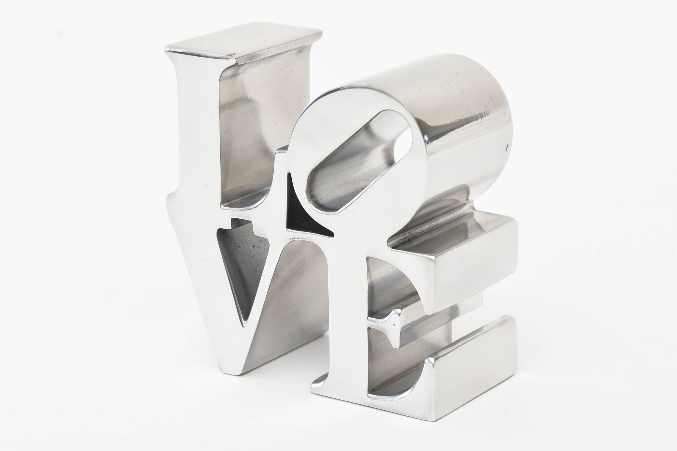 This Robert Indiana chrome paperweight sculpture is iconic. it was his Love paining that put him on the map of being in the league of collectable artists.
In this age now and world of non communication , love that is what we all need to be reminded