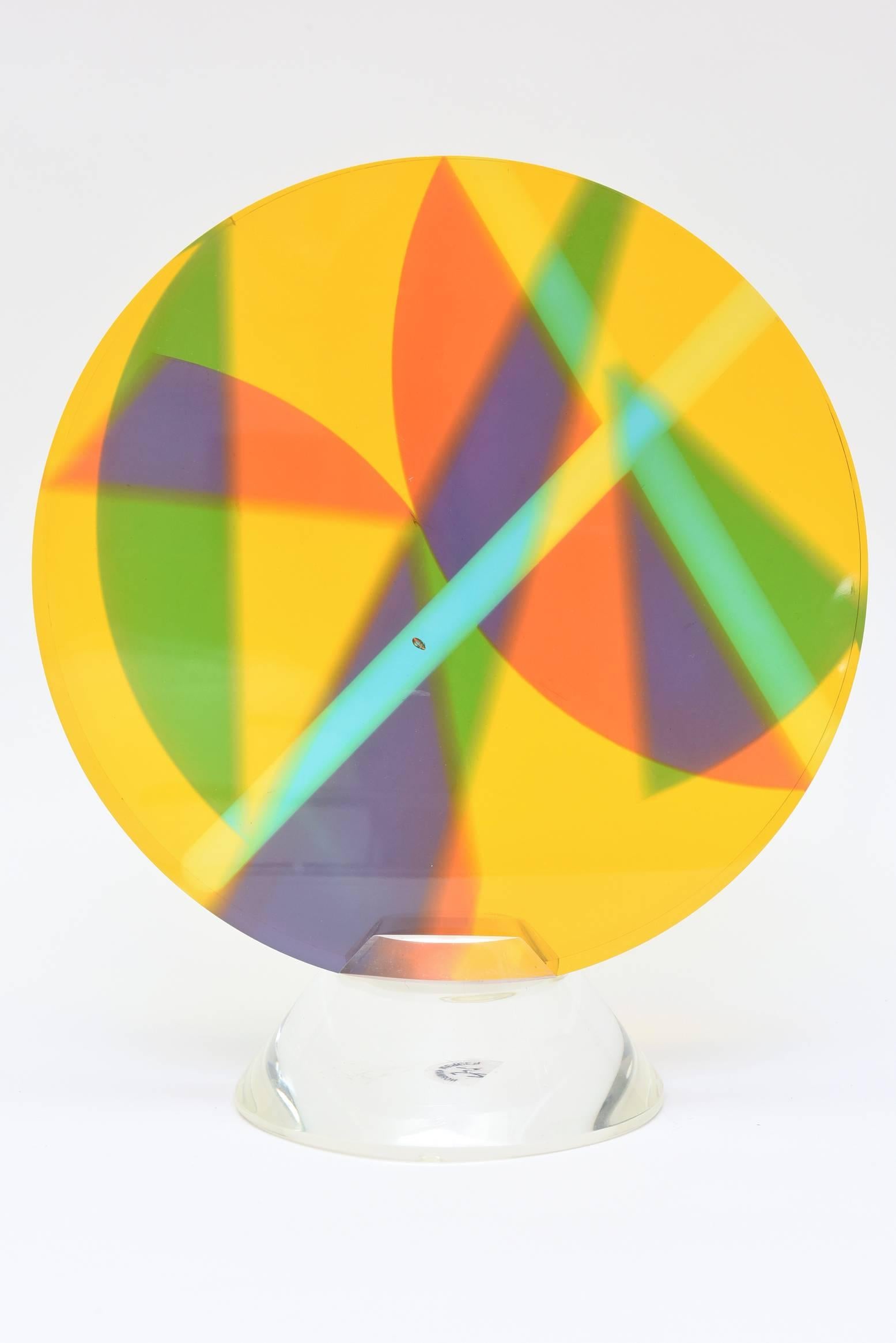 This is a fantastic Norman Mercer Lucite sculpture that almost looks like rays of light are hitting and going off in different directions.
The colors are fantastic and of course they change with the refraction and reflection of the play of light.
