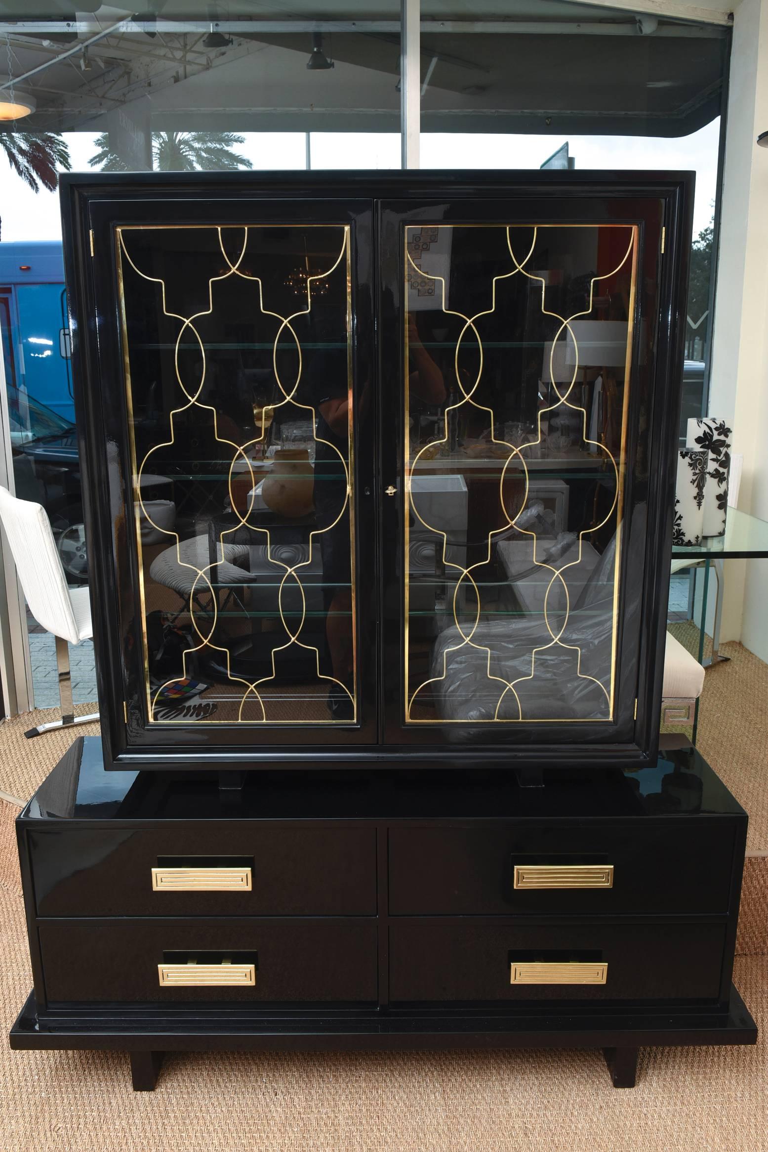 This amazing and rare restored and two part cabinet, buffet, console is beautiful. It is by Grosfeld House and rarely seen. It is from the 1940s and is Hollywood Regency yet modern and remains so very elegant. All of the brass hardware is original