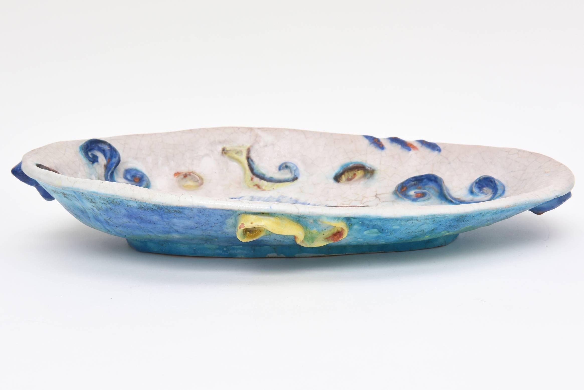 This Italian amazing, textural and dimensional ceramic bowl by Fantoni is a studio piece. It is even entitled "Chantal."
This is a rare work of his. It is monumental in size.
The colors and layers of salt glaze are sensational. It has