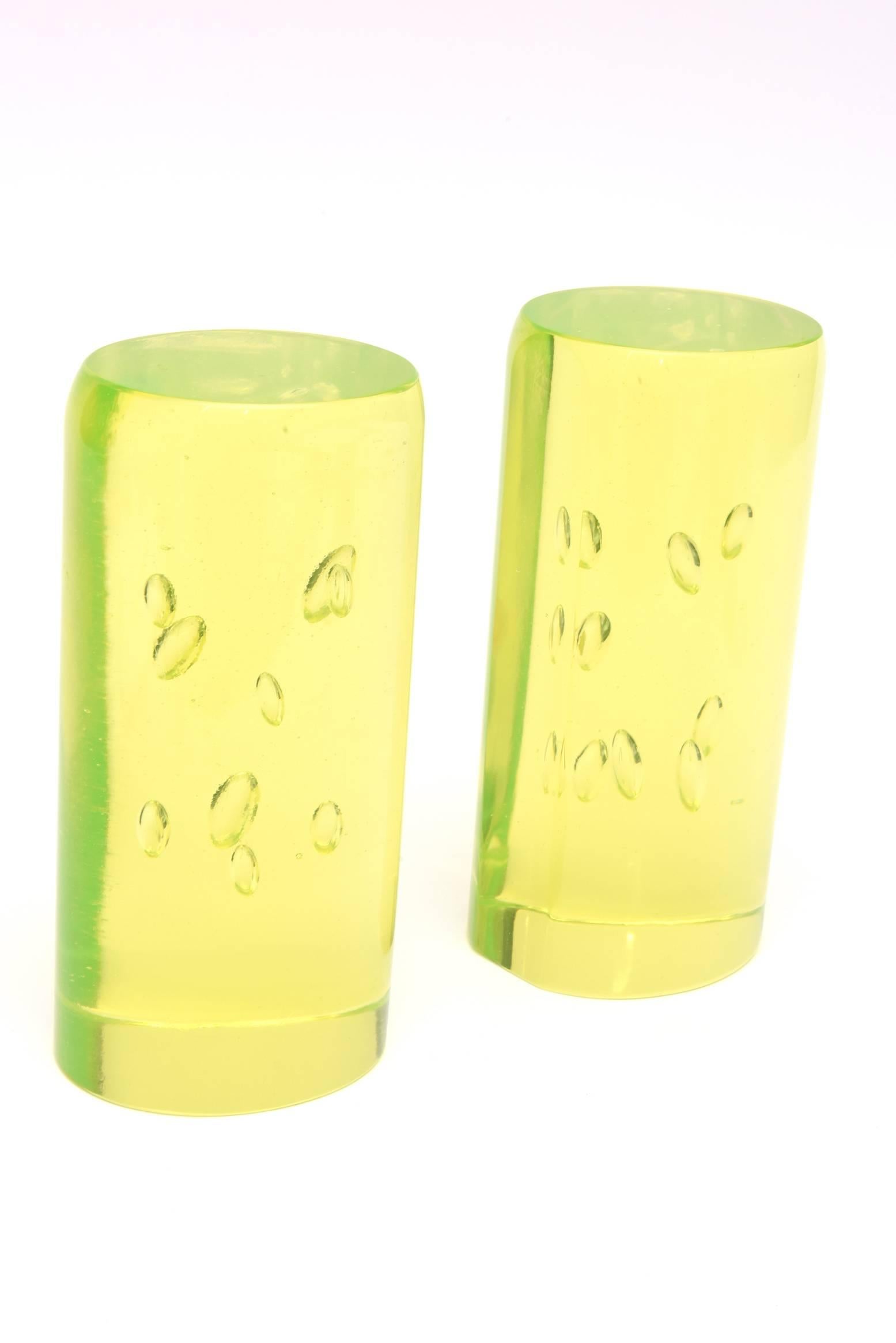 In these fabulous vintage Italian Murano bookends by Cenedese, the unusual and luscious vibrant color of chartreuse is brilliant. The large controlled bubbles seem to float in the space of glass and the original paper label on them is still intact.