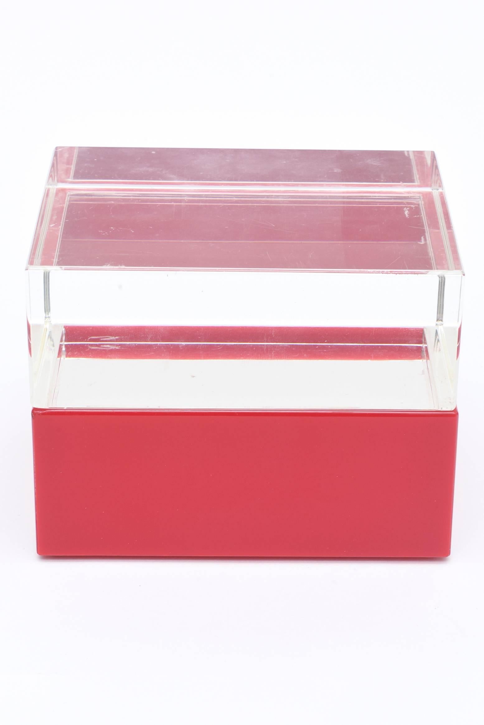 Red is a magical color in this Italian signed two-part Lucite box by Alessandro Albrizzi.
It has good weight to it. There is a clear thick Lucite top. This is great desk accessory. 
What a great holiday gift this makes!!

   