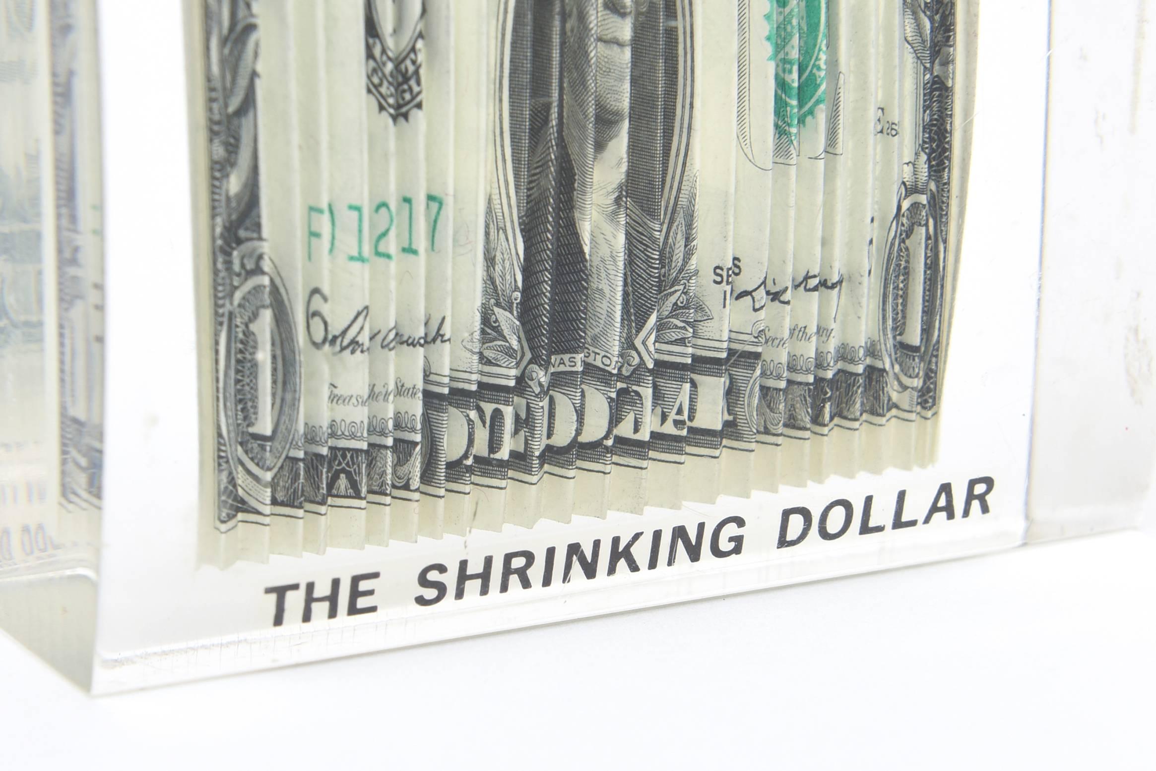 Late 20th Century Shrinking Dollar Lucite Pop Sculpture/Paperweight