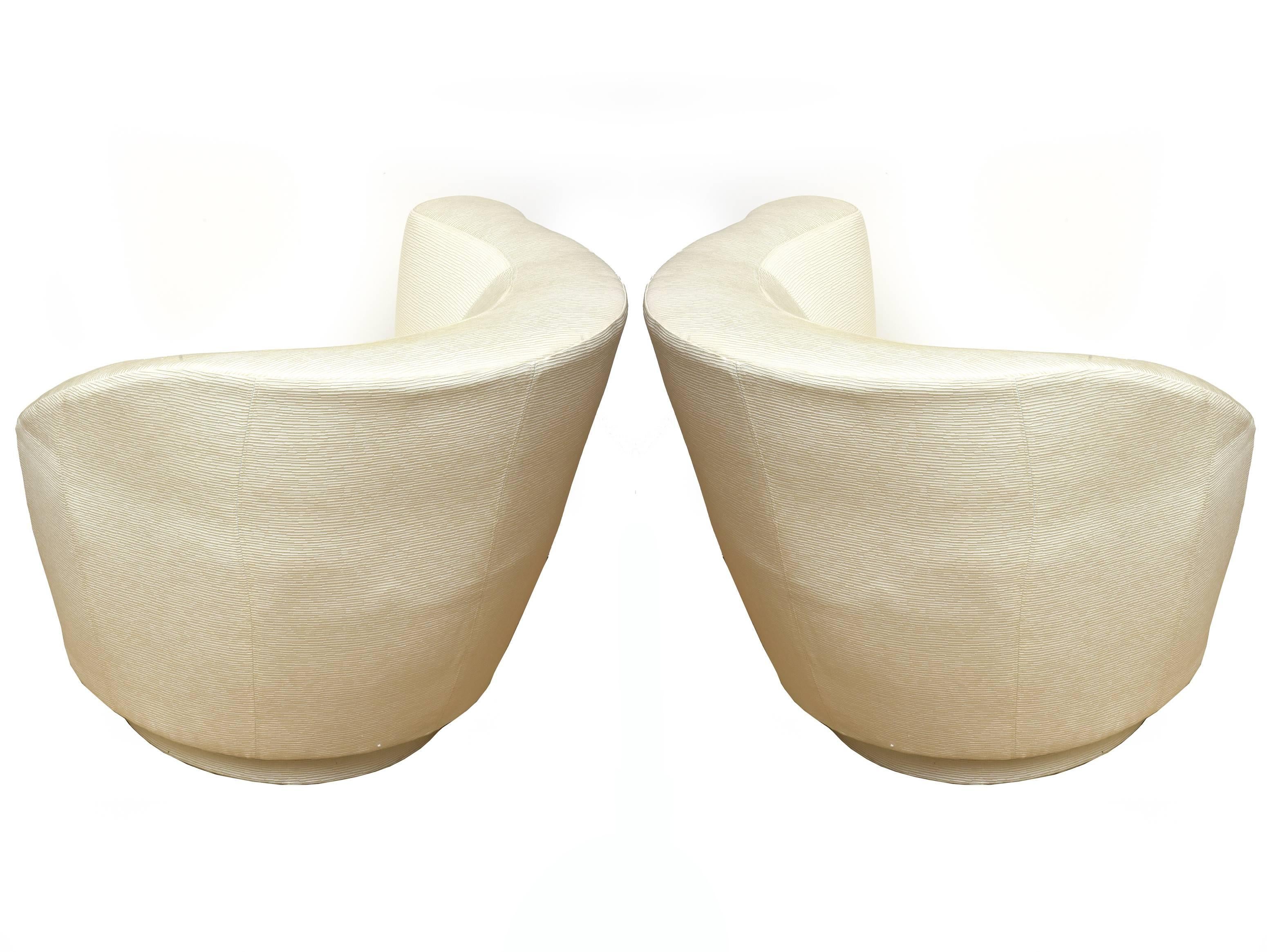 These corkscrew swivel vintage design lounge chairs by Vladimir Kagan for Directional are extremely comfortable. They have been newly upholstered in an off-white textural raised beautiful file fabric. They are elegant now! The seat depth is 22