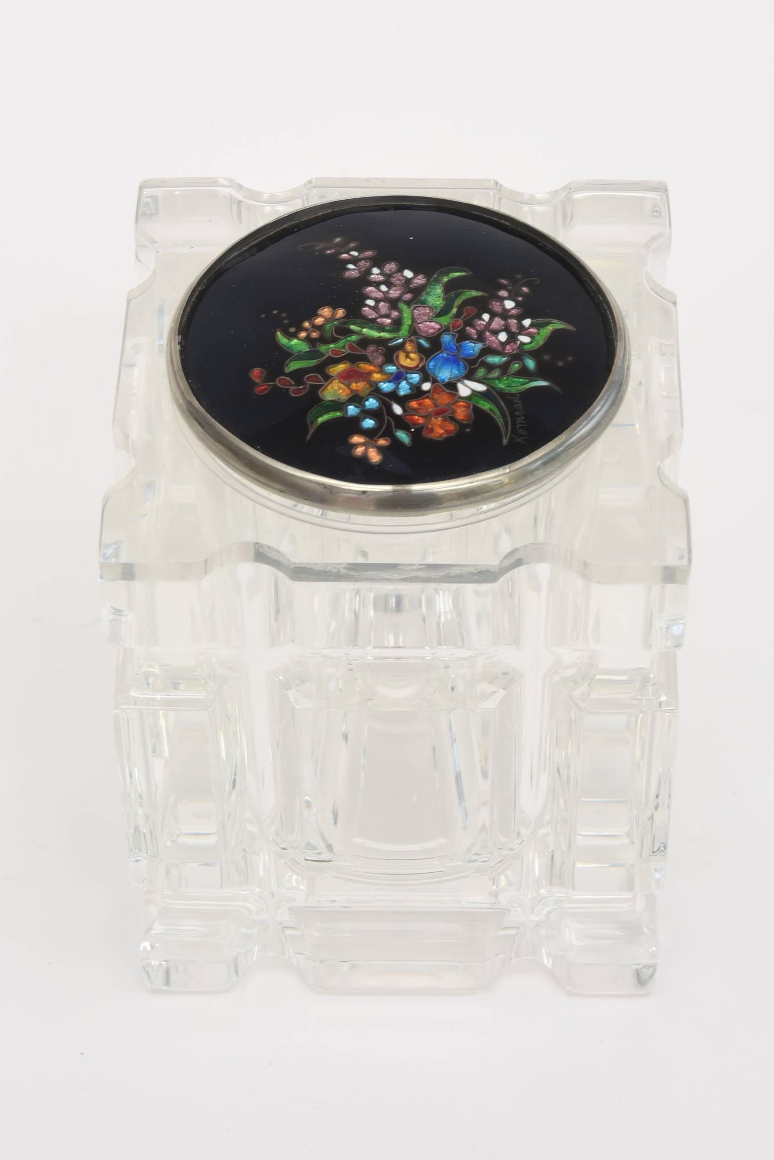The beautiful detail of this vintage lucite box, vessel or container is the work of artist Komrad as signed on the top. It has gorgeous detail with mixed-media of foiled enameled and cloisonné work on the top that is solely lucite on the bottom. Has